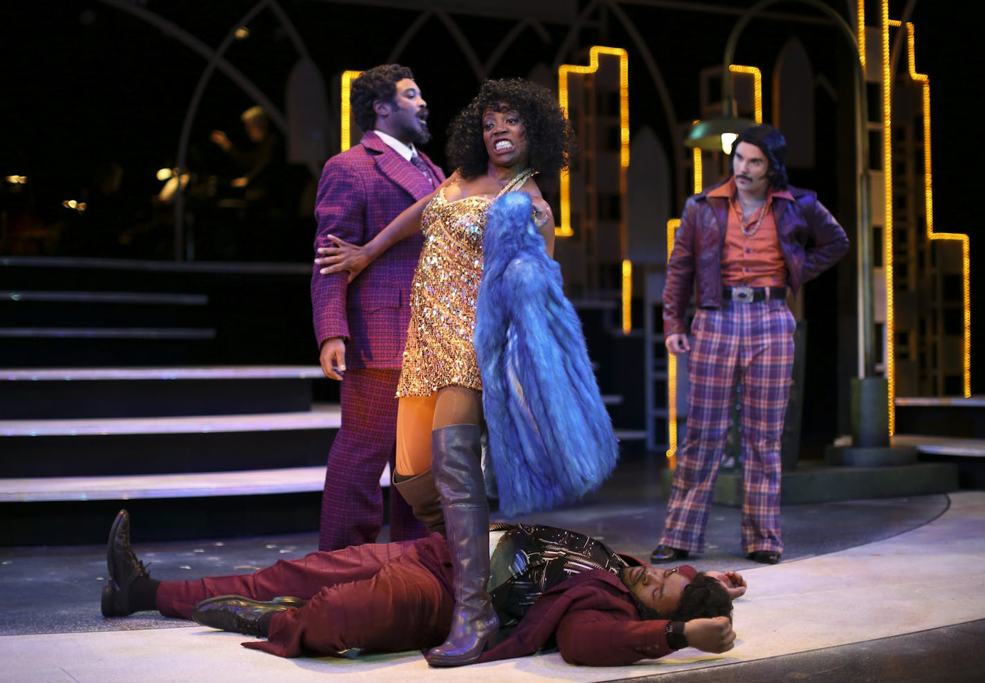 Regina Marie Williams as Deloris Van Cartier gingerly steps over the body of Roland Hawkins as Ernie in a first act scene from "Sister Act" with with Andre Shoals as Curtis Shank and Daniel S. Hines as Pablo, right, during the first dress rehearsal Wednesday night. ] JEFF WHEELER &#x2022; jeff.wheeler@startribune.com The musical "Sister Act," starring Regina Marie Williams is in rehearsals this week at Chanhassen Dinner Theatre. The cast held their first dress rehearsal Wednesday night, October