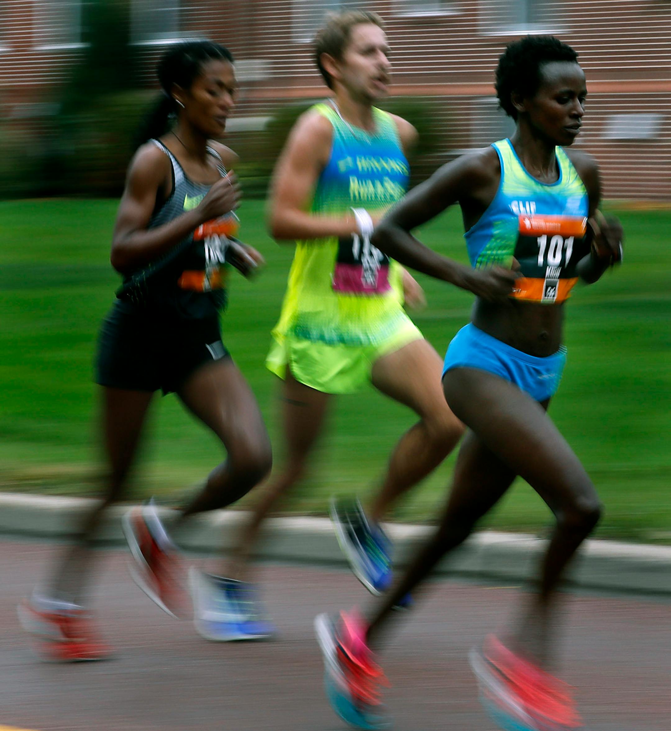 Jane Kibii(101) leads a group at the 17-mile mark.] Twin Cities Marathon. Starts at U.S. Bank Stadium, ends at the Capital. 10 mile race is similar.