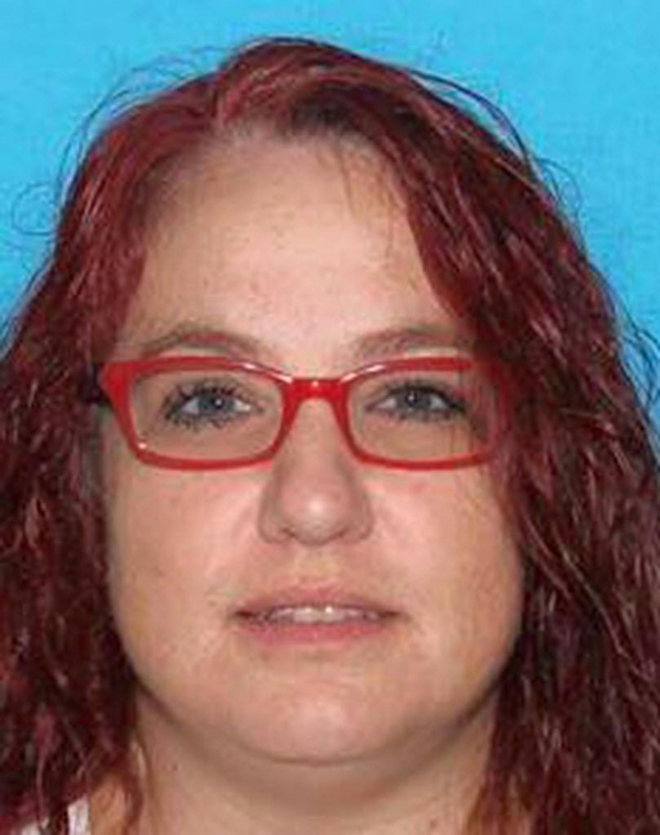 This undated driver's license photo provided by the Pennsylvania Department of Transportation shows Tierne Ewing of West Finley Township, Pa. Pennsylvania State Police say Kevin Ewing, a man free on bond while awaiting trial on charges he beat his wife Tierne Ewing while holding her captive for nearly two weeks, kidnapped her again at gunpoint Tuesday, Aug. 30, 2016, from a residence in West Finley Township, Pa., about 50 miles southwest of Pittsburgh along the West Virginia border.