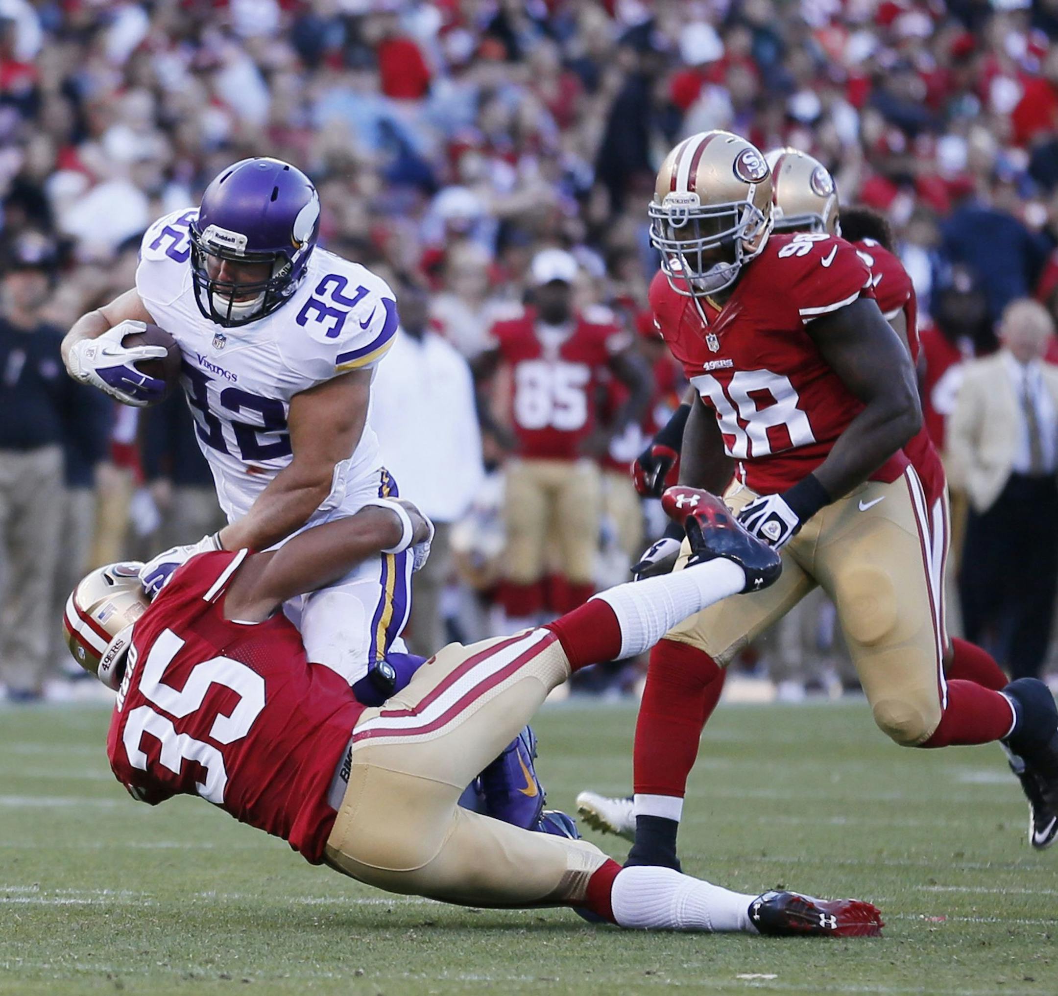 Minnesota Vikings running back Toby Gerhart picks up a first down over San Francisco 49ers Eric Reid during a preseason game at Candlestick Park in San Francisco, California, Sunday, August 25, 2013. (Jerry Holt/Minneapolis Star Tribune/MCT) ORG XMIT: 1142479 ORG XMIT: MIN1308252127226807