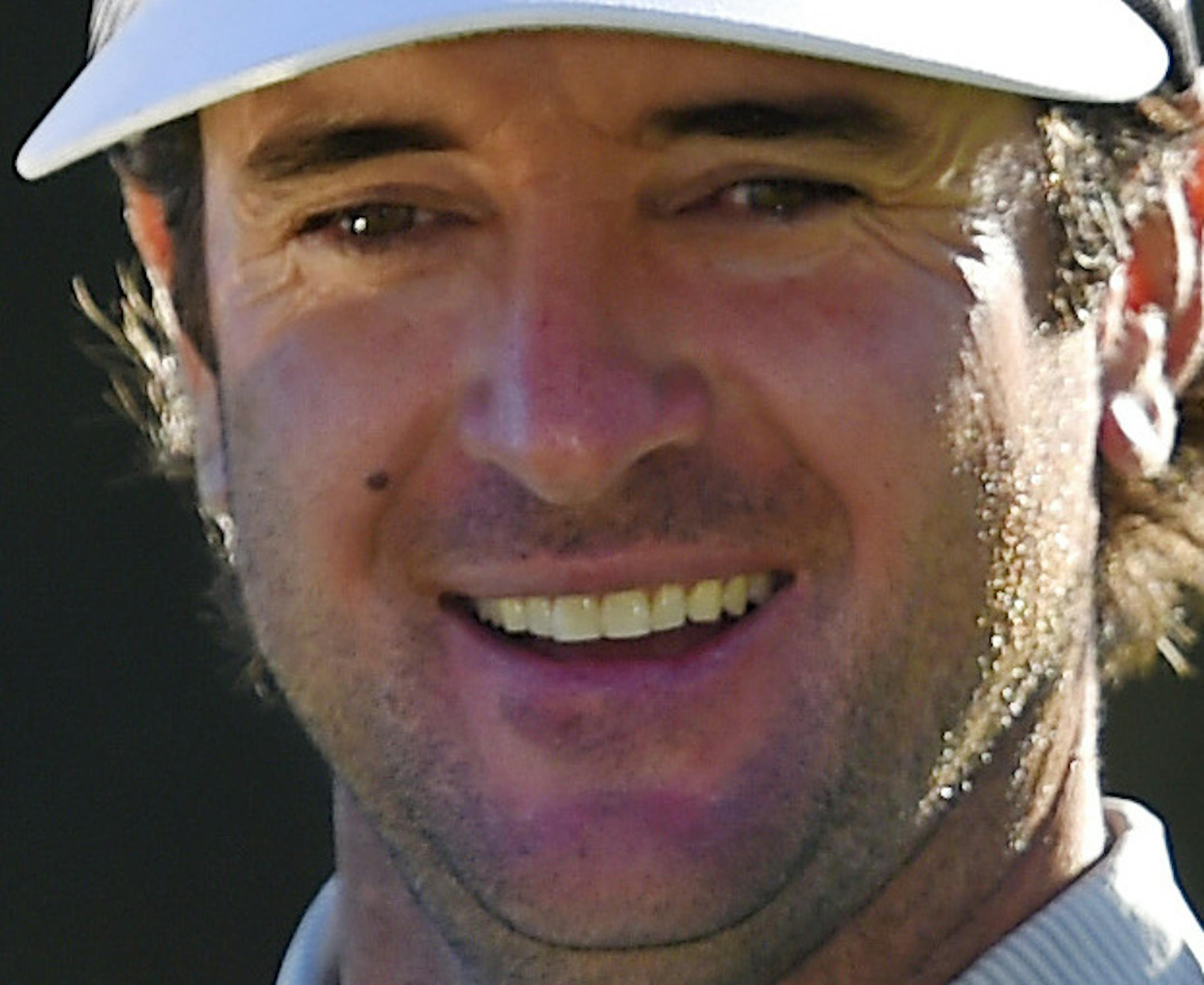 Bubba Watson holds up his trophy after winning the Northern Trust Open golf tournament, Sunday, Feb. 21, 2016, in the Pacific Palisades section of Los Angeles. (AP Photo/Mark J. Terrill)