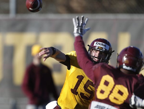 Conor Rhoda (15) threw a pass during spring practice.