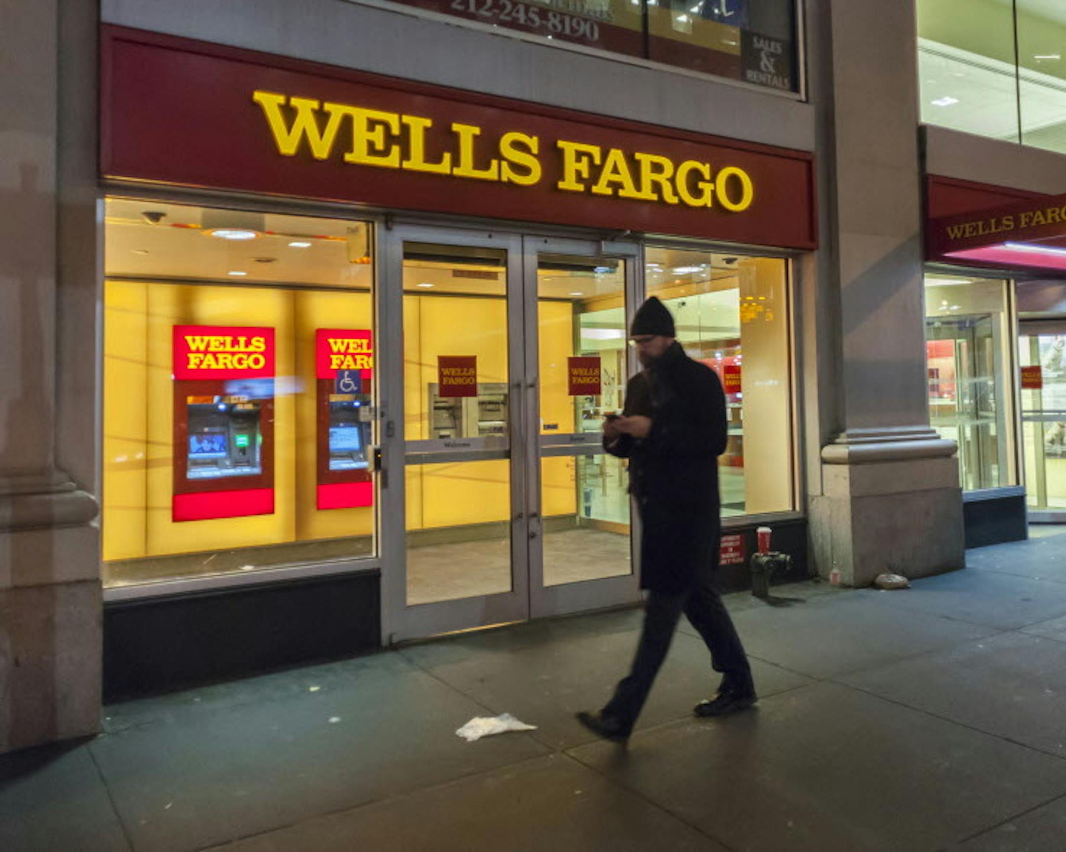 A branch of Wells Fargo in New York. On Thursday, the San Francisco-based bank reported essentiall flat quarterly net profit. It also said new checking account openings were down in March from a year earlier. (Richard B. Levine/Sipa USA/TNS) ORG XMIT: 1200621