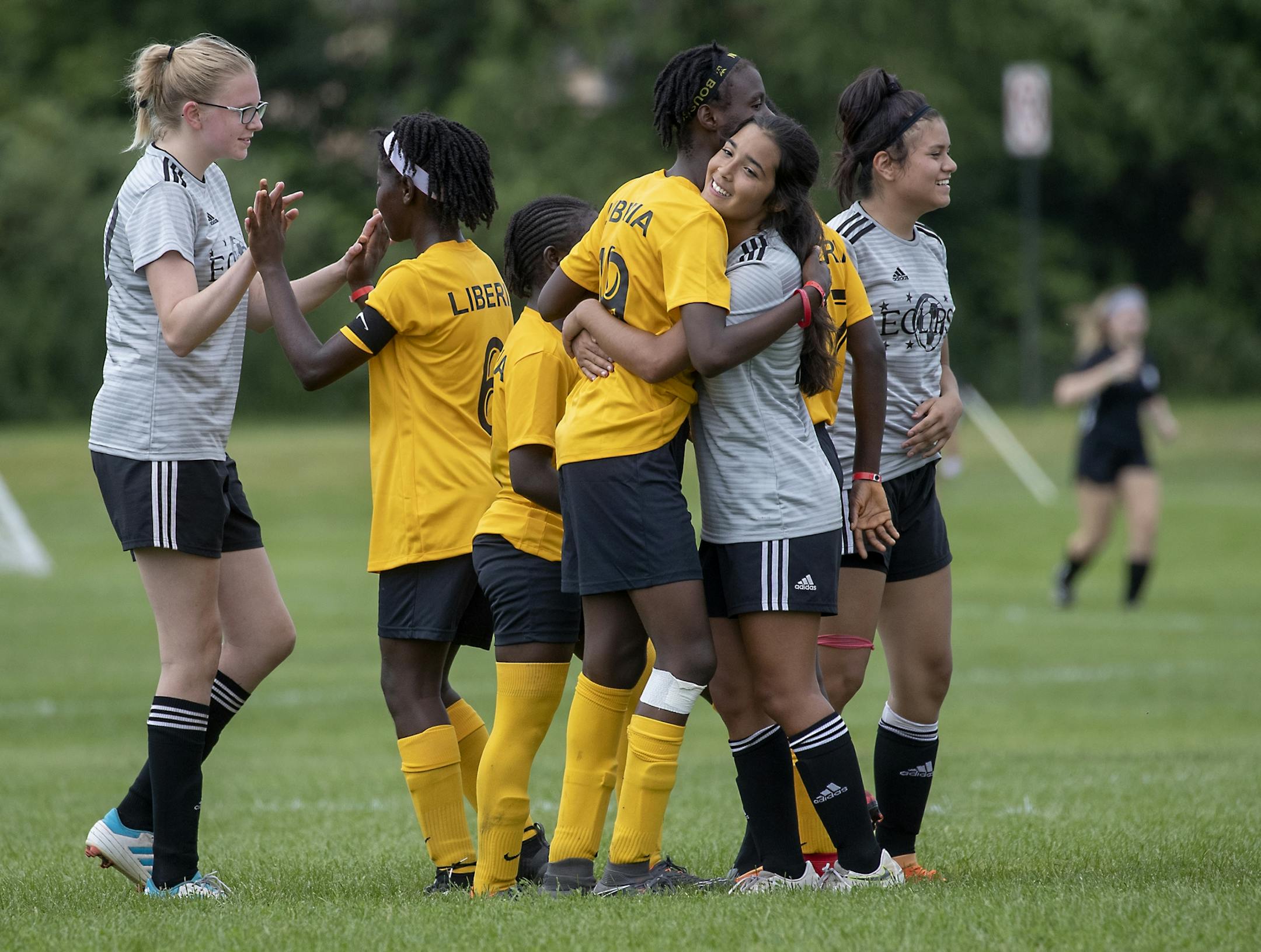 The Monrovia Football Academy greeted the Eclipse Select MN Regional with hugs after they defeated them 9-1 during the USA Cup tournament, Tuesday, July 16, 2019 at the National Sports Center in Blaine, MN. The youth soccer team from Liberia traveled to Minnesota for its first trip to the States, to play in the mega-tourney and were supported by the local Liberian community.