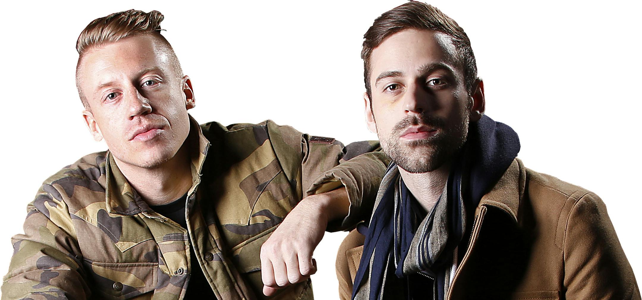 FILE - This Nov. 20, 2012 file photo shows Ben Haggerty, better known by his stage name Macklemore, left, and his producer Ryan Lewis at Irving Plaza in New York. The rapper Macklemore thinks there's a simple reason his hit "Thrift Shop" appears to be going viral: It dares to be different. The Seattle-based duo has sold 2.3 million copies so far _ a million in the last month alone _ and sales continue to grow week to week. (Photo by Carlo Allegri/Invision/AP, file) ORG XMIT: MIN2013021415020485