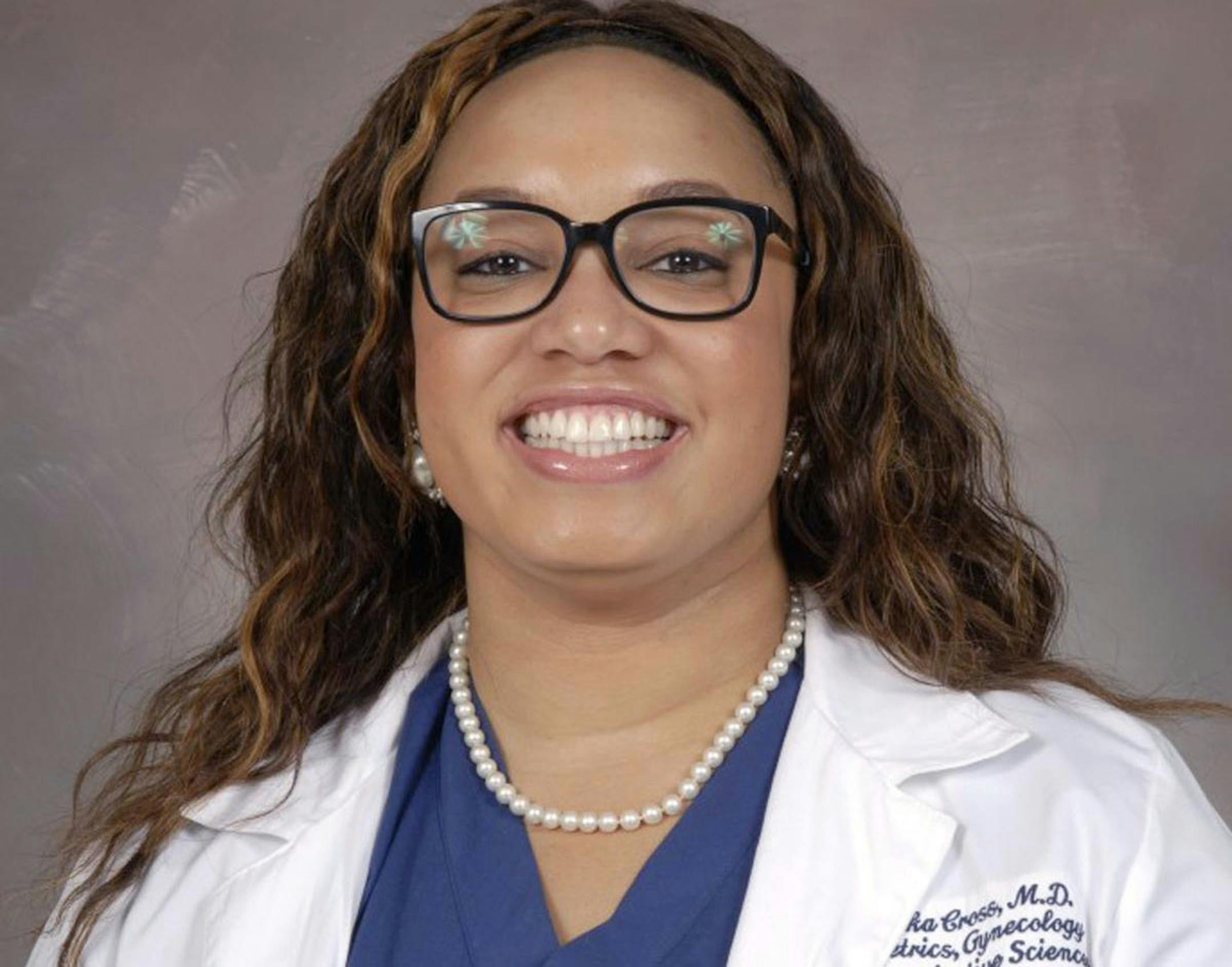 Dr. Tamika Cross, an OB-GYN, said she raised her hand to help an unresponsive stranger on a Delta flight but was rebuffed by a flight attendant.