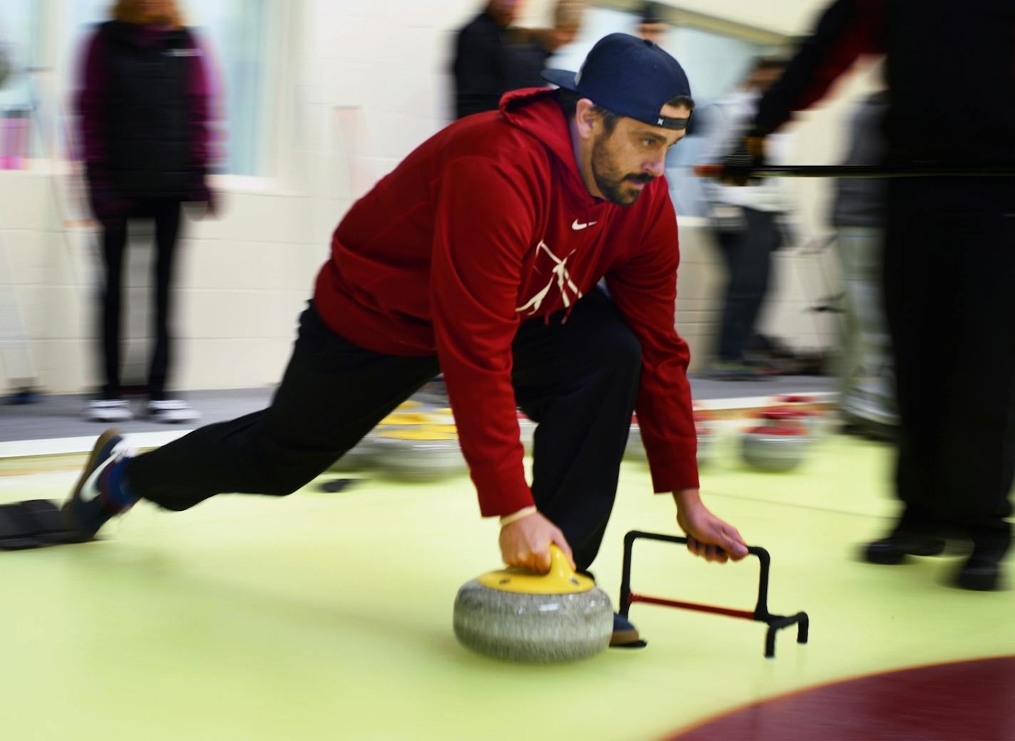 Aaron Martineau used a bracket for support as he launched his stone toward the bull's-eye more than 100 feet away.