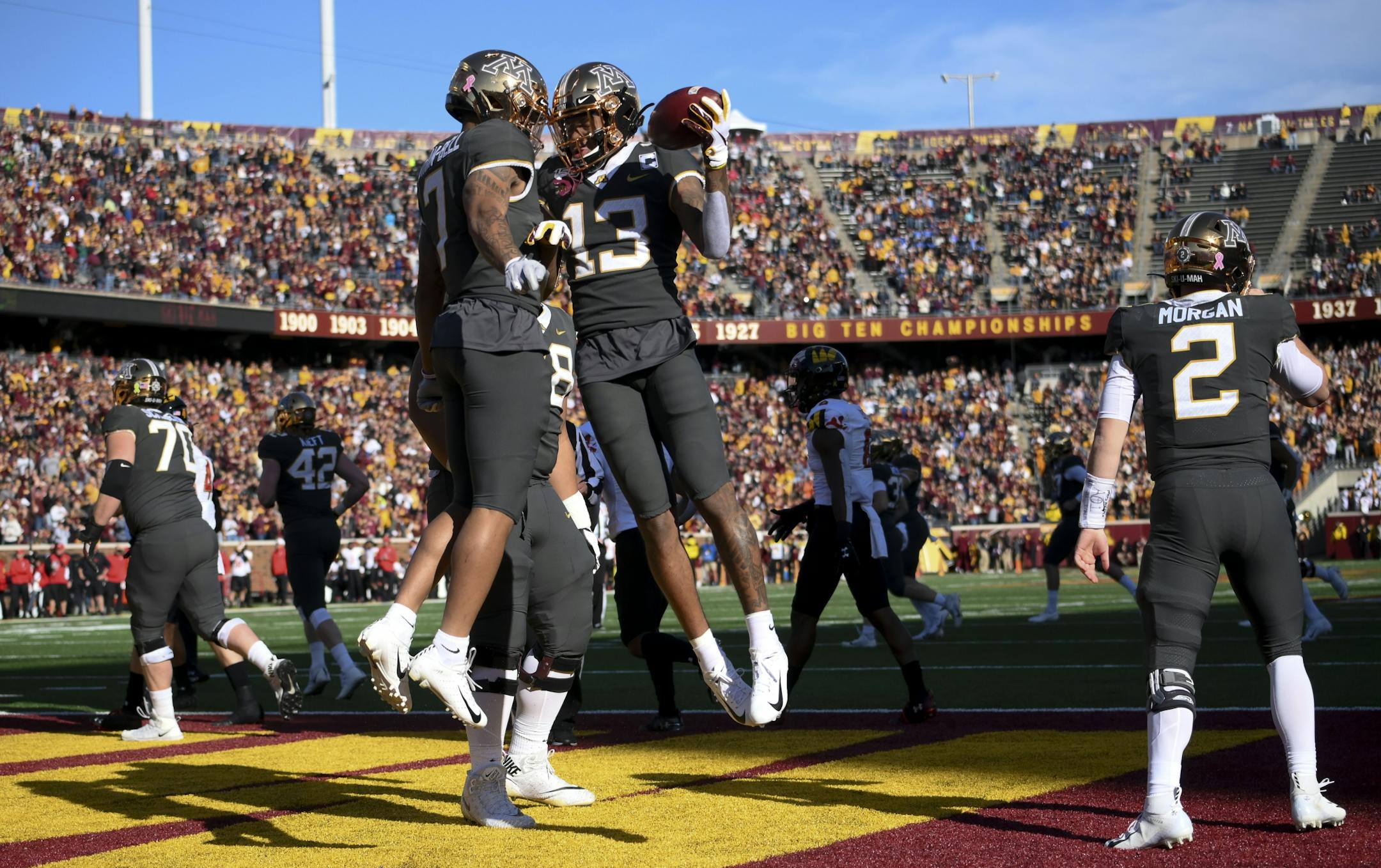 Gophers wide receiver Chris Autman-Bell (7) and wide receiver Rashod Bateman (13) celebrated Bateman's first quarter touchdown against Maryland.