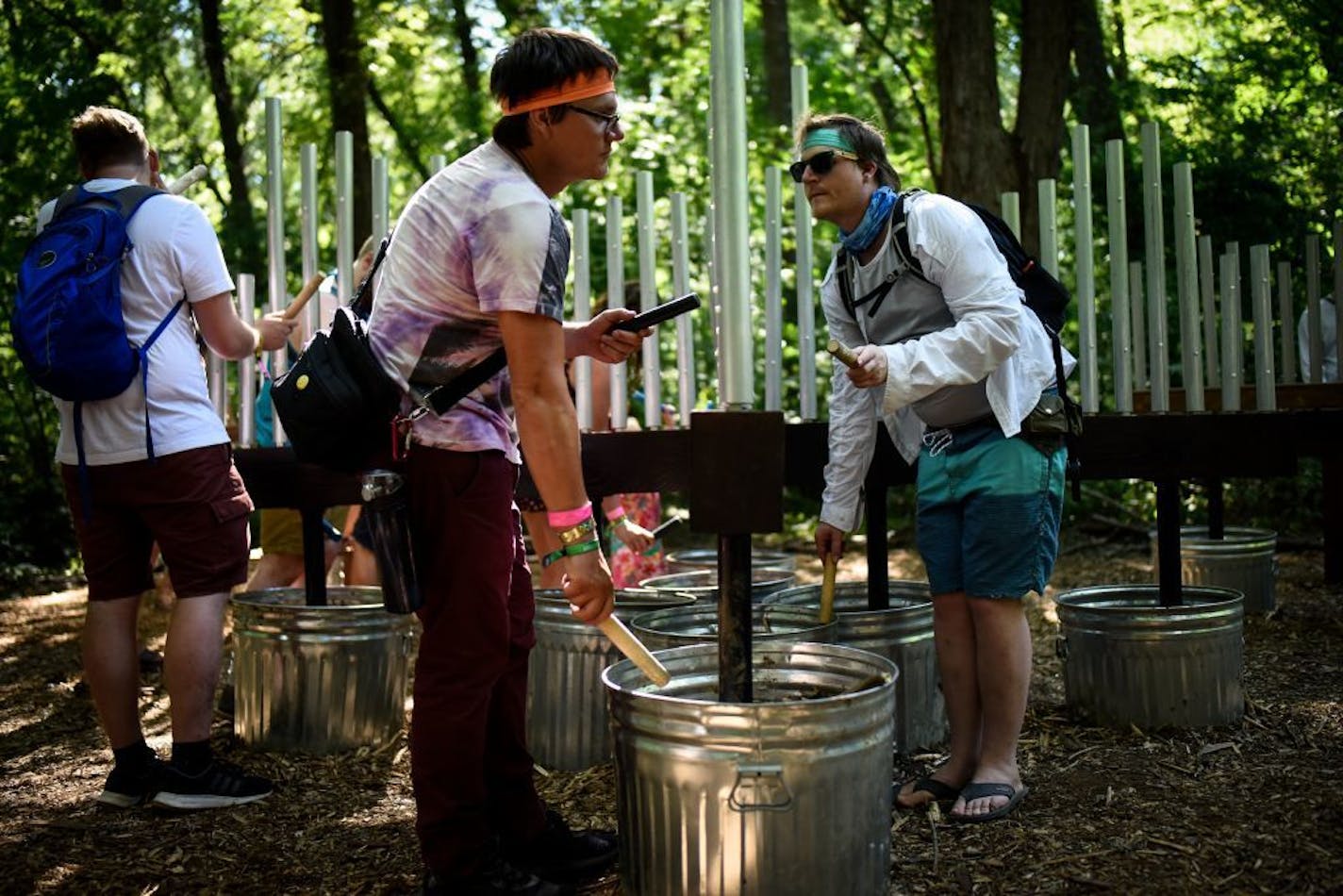 Festival goers took part in an immersive music installation, called "Player-Fence," Saturday in The Woods at the Eaux Claires Music and Art Festival.