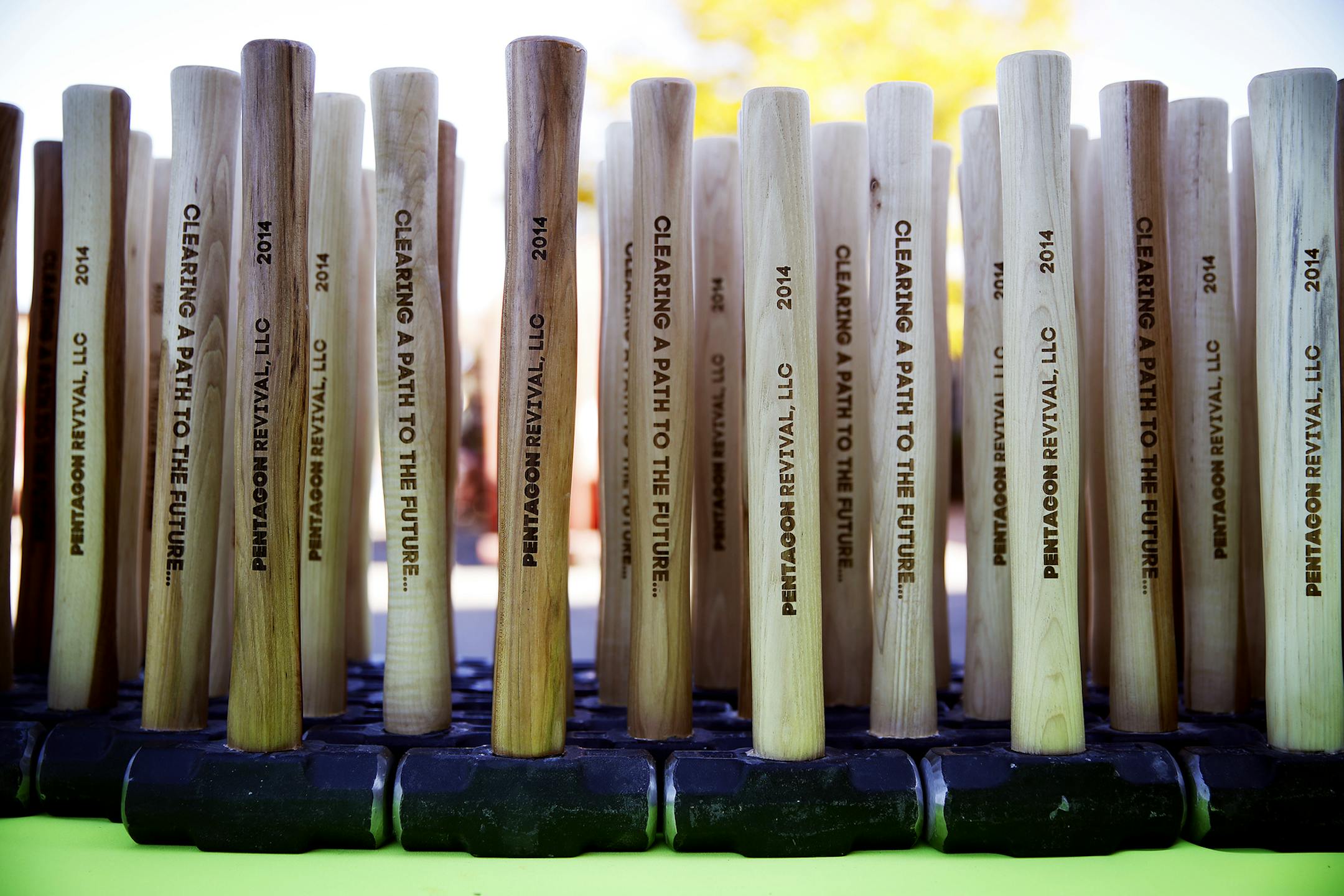 Souvenir sledgehammers available for use during a ceremonial sledgehammer and graffiti party for local officials at a demolition site inside Pentagon Park in Edina. ] LEILA NAVIDI leila.navidi@startribune.com / BACKGROUND INFORMATION: Tuesday, October 21, 2014. Once a trendsetting 1960s suburban office park, today Edina‚Äôs Pentagon Park is a dated cluster of 15 deteriorating buildings, most recently known for foreclosure and failed renewal plans. City officials say the proposed