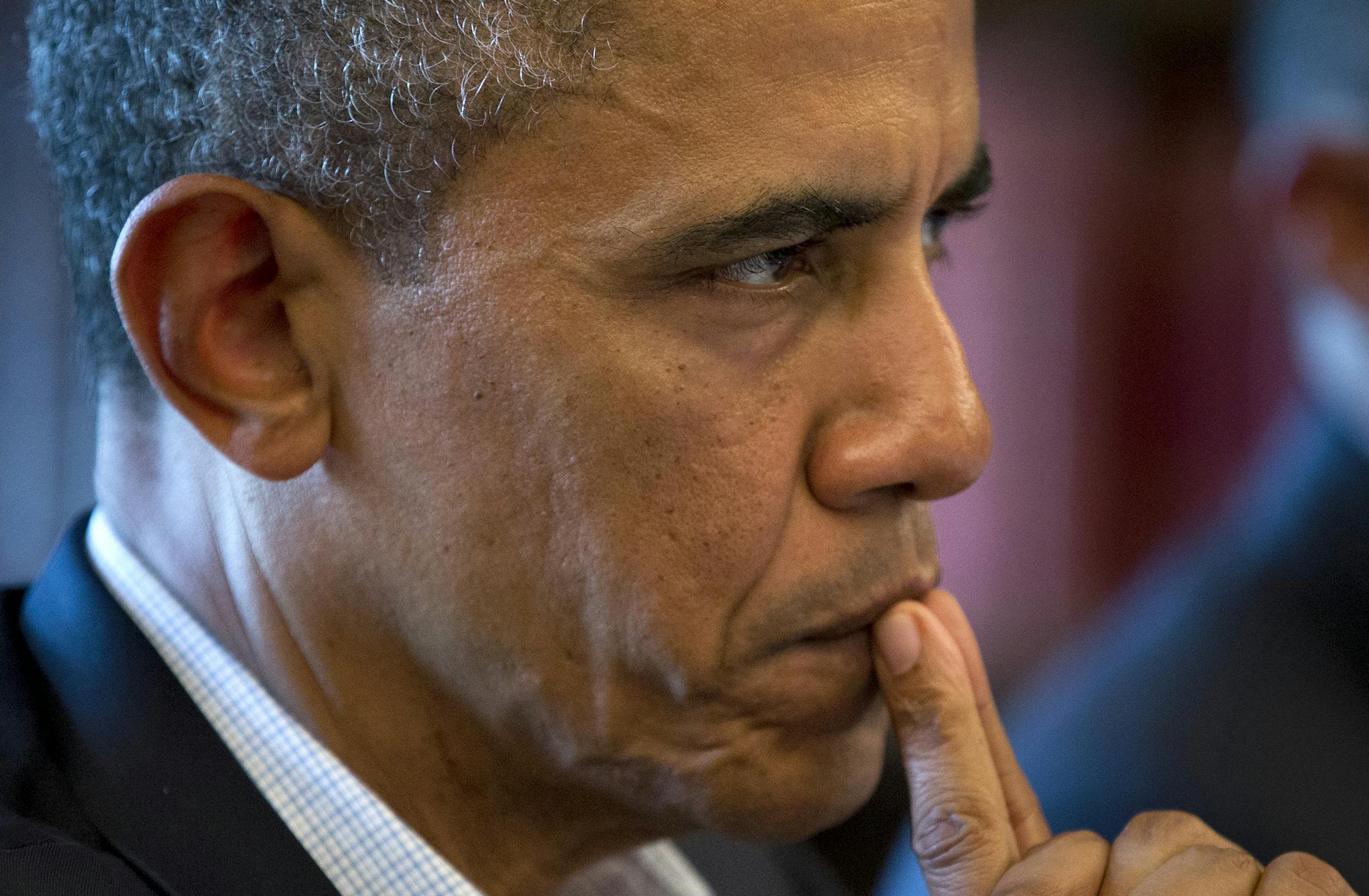 President Barack Obama listens to French President Francois Hollande during the G-8 summit at the Lough Erne golf resort in Enniskillen, Northern Ireland, Tuesday, June 18, 2013. The final day of the G-8 summit of wealthy nations is ending with discussions on globe-trotting corporate tax dodgers, a lunch with leaders from Africa, and suspense over whether Russia and Western leaders can avoid diplomatic fireworks over their deadlock on Syriaís civil war. (AP Photo/Evan Vucci)