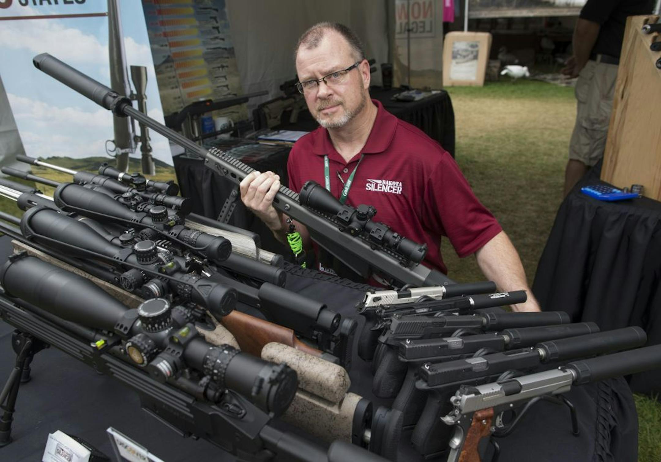 Mike Lawrence, Dakota Silencer.   The 2015 Gamefair has developed from one big circus tent to a mini State fair atmosphere over its 34 years. We photographed a slice of the fair through the people that have attending this year, some who have been all 34 years.  [ PHOTO BY TOM WALLACE ' tom.wallace2@comcast.net   owfair081415: Game Fair