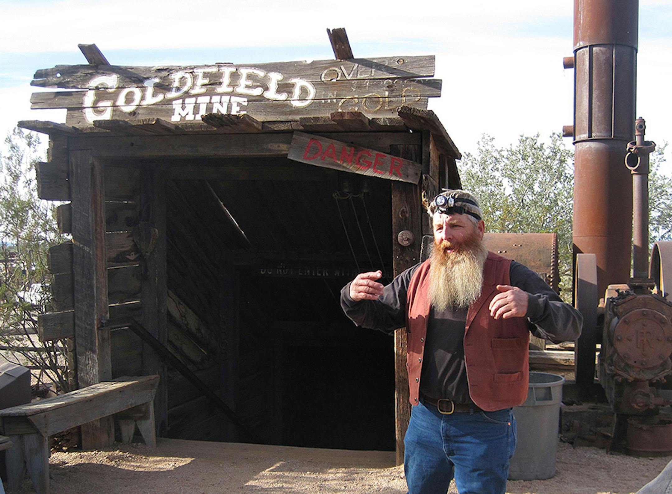 A guide stays in character as �Cousin Jack� as he prepares to bring visitors underground to a replica gold mine at the Goldfield Ghost Town.