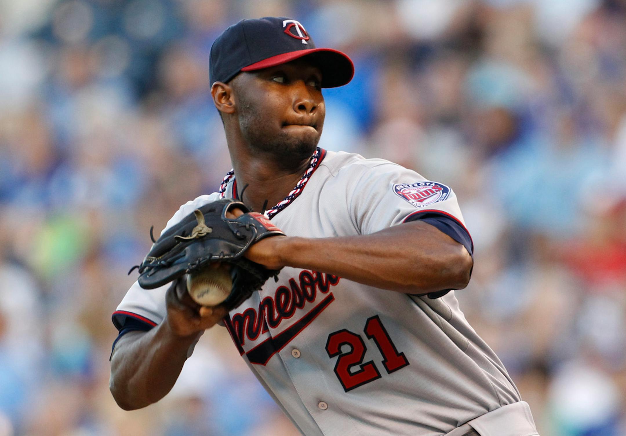 Minnesota Twins pitcher Samuel Deduno winds up in the first inning of a baseball game against the Kansas City Royals at Kauffman Stadium in Kansas City, Mo., Wednesday, Aug. 7, 2013. (AP Photo/Colin E. Braley)