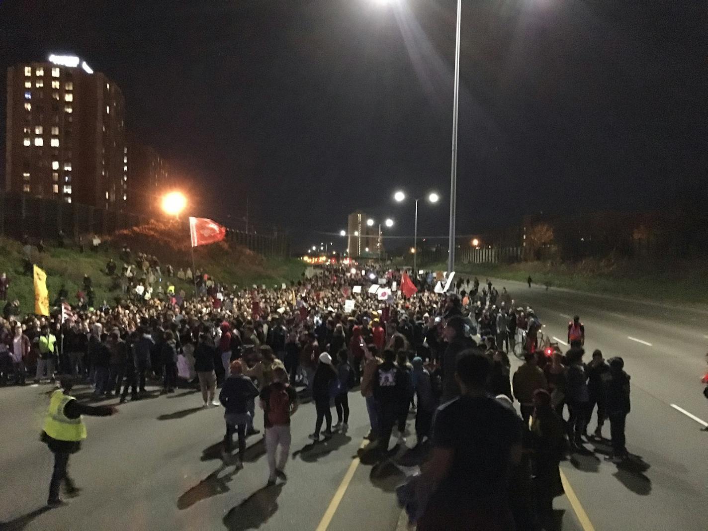 Anti-Trump protesters block Interstate Hwy. I-94 at Cedar Avenue Thursday night.