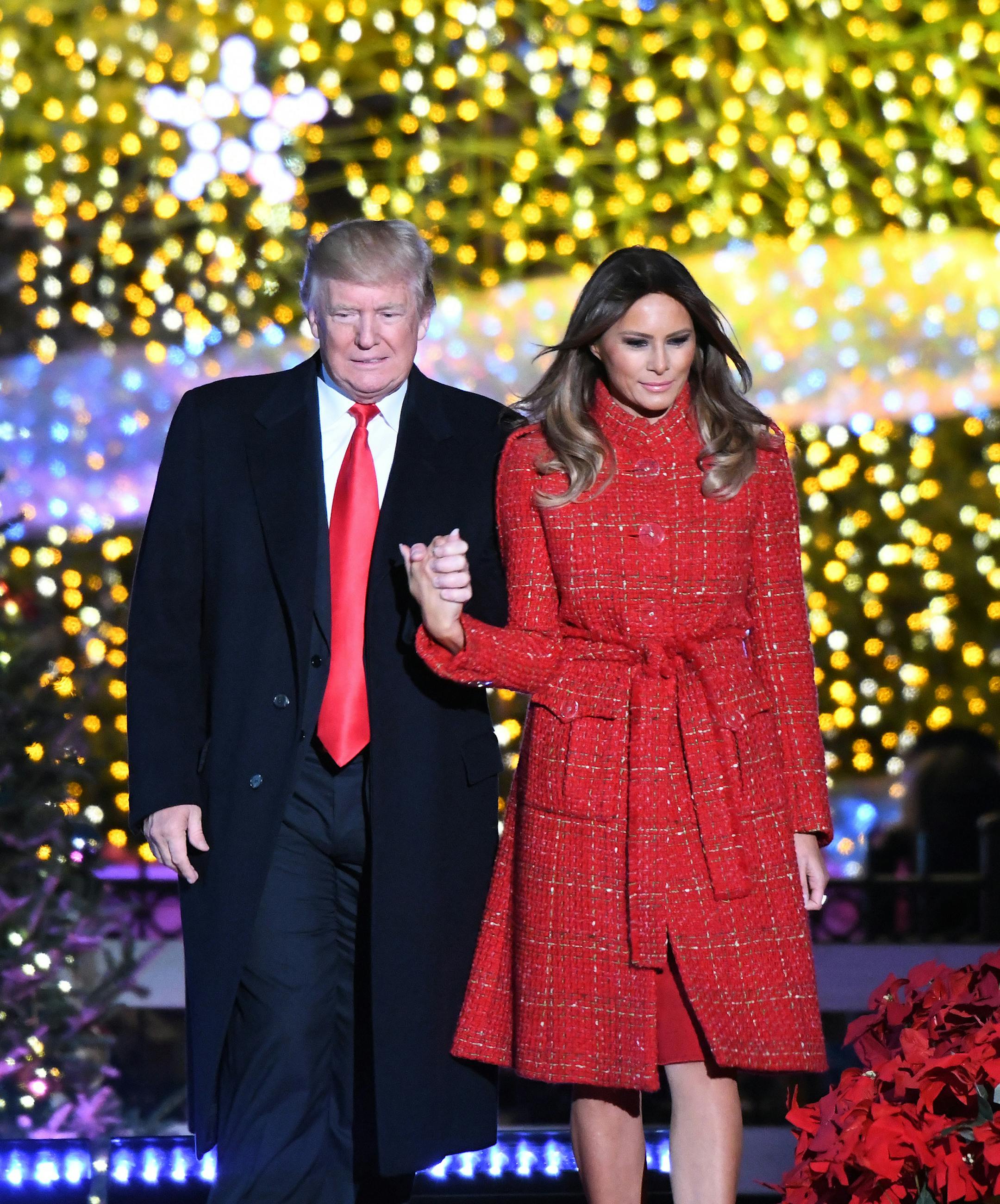 U.S President Donald Trump and first lady Melania Trump arrive on stage after they lit up the National Christmas Tree at the National Christmas Tree Lightening Ceremony on Nov. 30, 2017 in Washington, D.C. (Olivier Douliery/Abaca Press/TNS) ORG XMIT: 1217357