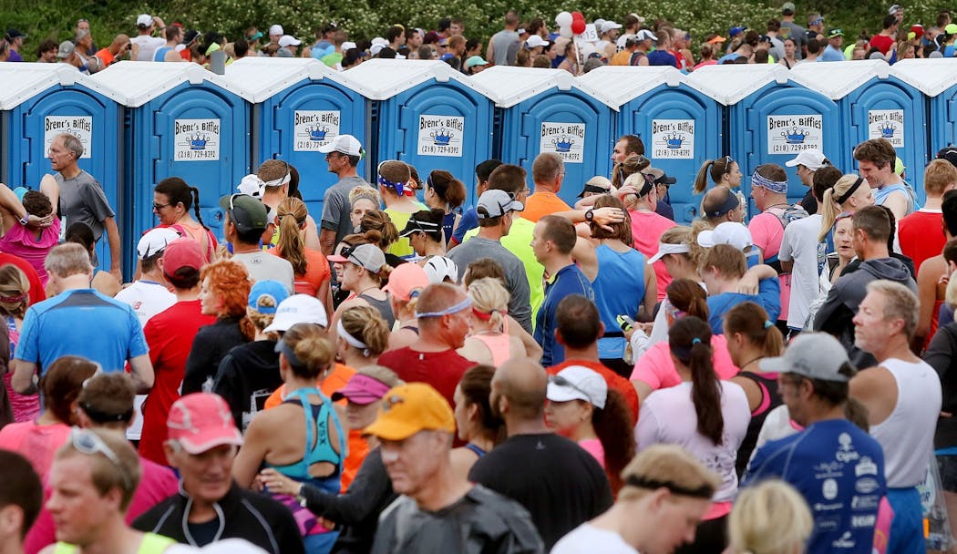 Thousands of runners line up at the biffies before the start of the 2017 Grandma's Marathon.
