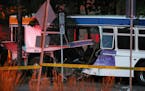 A damaged Metro Transit bus could be seen as police investigated the scene. ] ANTHONY SOUFFLE &#xd4; anthony.souffle@startribune.com Police investigat