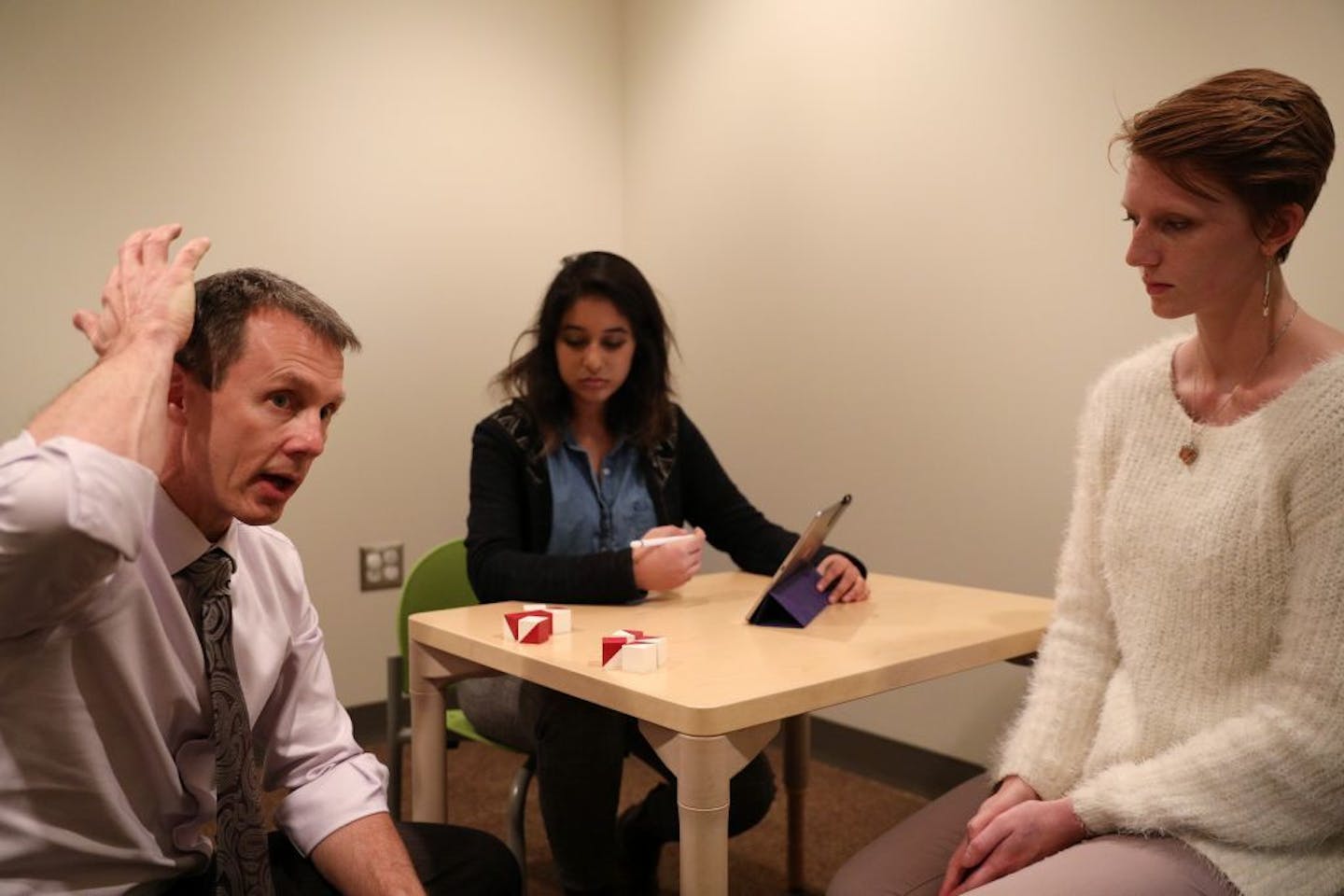 Dr. Jeff Wozniak with the University of Minnesota's psychiatry department talked as clinical research coordinators Priya Bansal and Mariah Schumacher went over cognitive tests they would use to analize the differences between healthy children and those with fetal alcohol spectrum disorder.