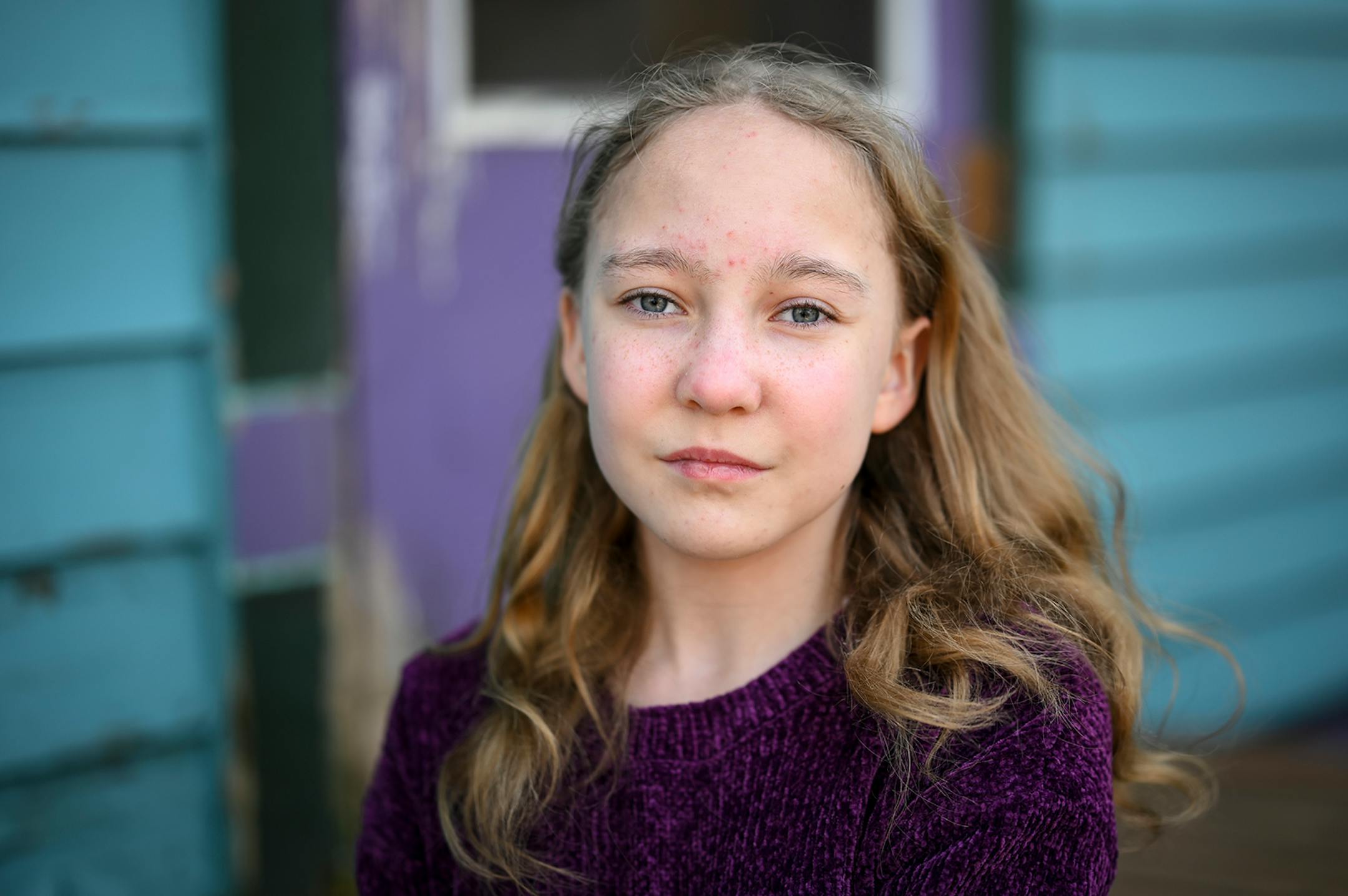 Beatrix Rhone, 12, stood for a portrait behind her St. Paul home Wednesday afternoon. To stay busy, she's been practicing circus on the trapeze in her backyard, Facetiming friends, and singing Disney songs and posting them on Instagram. "It makes me feel sad because I cant see my friends, "Beatrix said of the pandemic, "But I'm happy I'm quarantining so I can help other people."