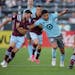 Minnesota United midfielder Emanuel Reynoso, center, vies for control of the ball with Colorado Rapids defender Keegan Rosenberry, left, and forward M