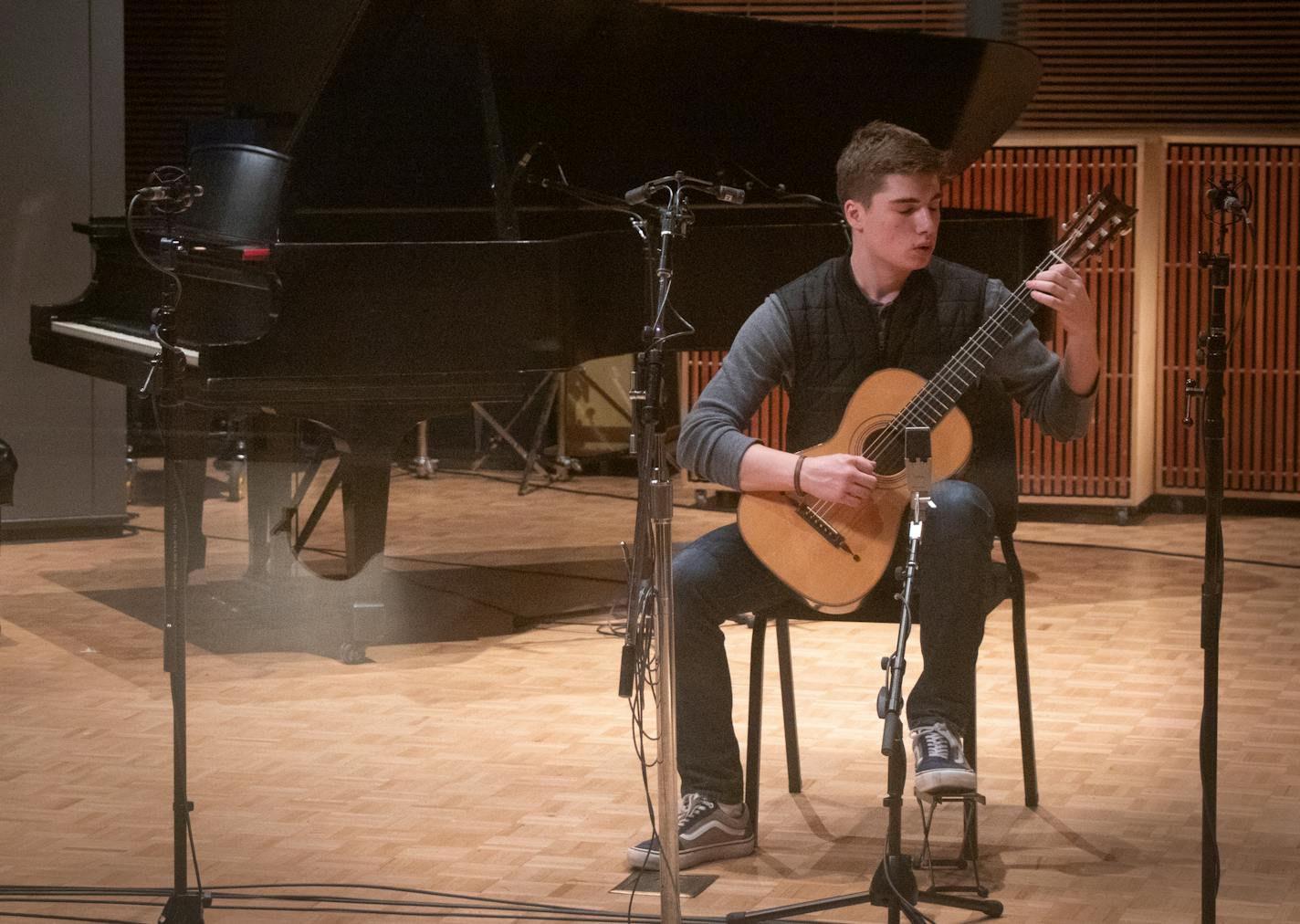 MN Varsity Featured Artist Jax Wittenberg records J.S. Bach&#x2019;s Gavotte I & II, BWV 995 on guitar in a recording studio at Classical MPR&#x2019;s headquarters in St. Paul on Saturday, Feb. 29, 2020. As part of the MN Varsity competition, Featured Artists are invited to make a professional quality recording of their competition piece to later be played on the radio as part of the competition. ] ANDY KOSIER&#x2022; andy.kosier@startribune.com