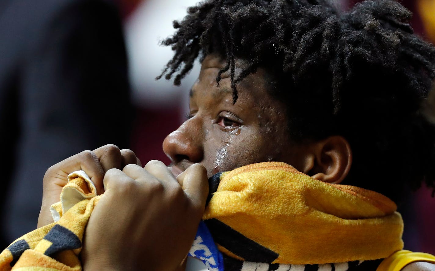 Minnesota center Daniel Oturu reacts on the bench at the end of a second round men's college basketball game against Michigan State in the NCAA Tournament, Saturday, March 23, 2019, in Des Moines, Iowa. Michigan State won 70-50. (AP Photo/Charlie Neibergall)