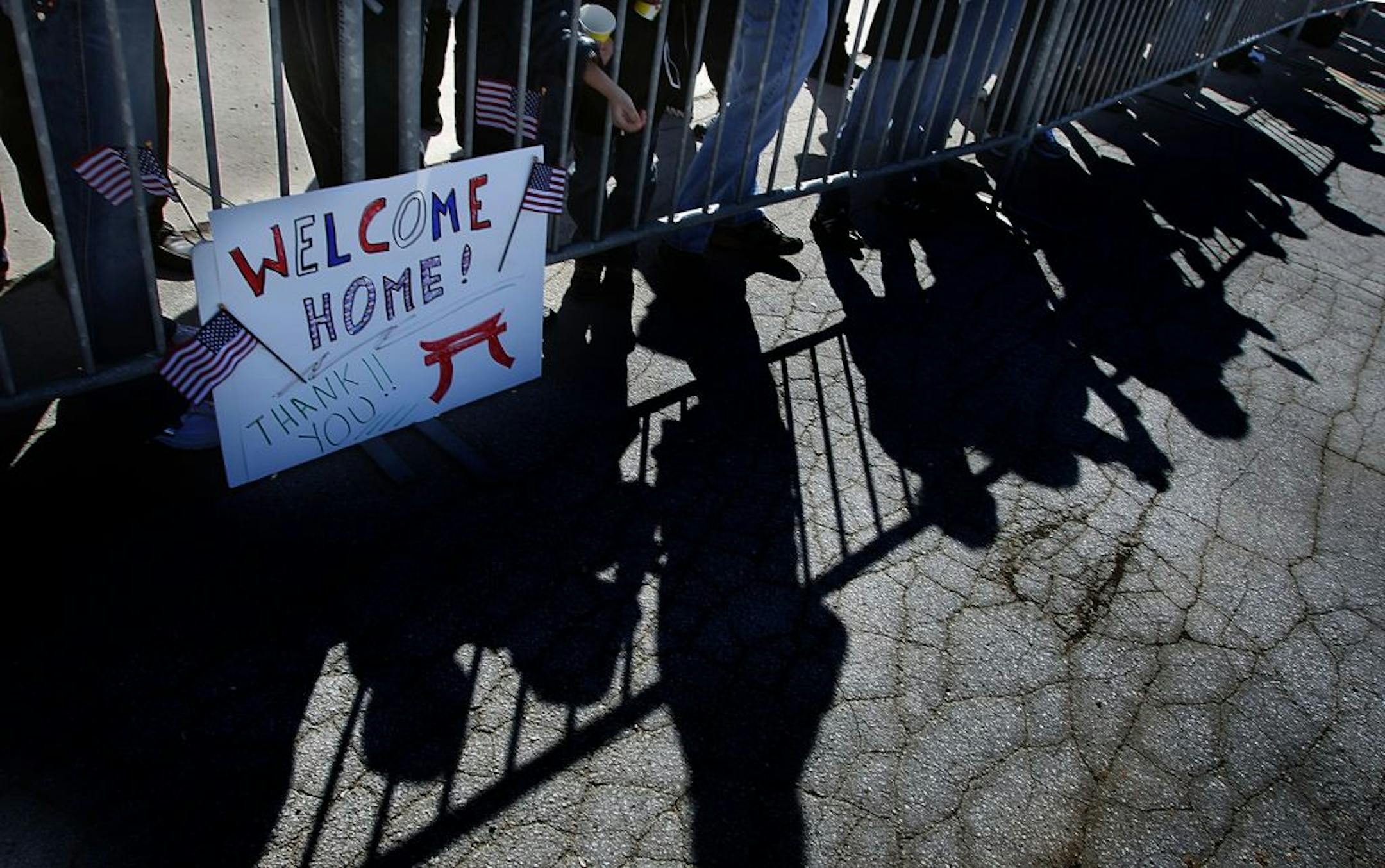 The shadows of family members and relatives were cast on the tarmac of an airfield at Fort Campbell as they welcomed the soldiers home.