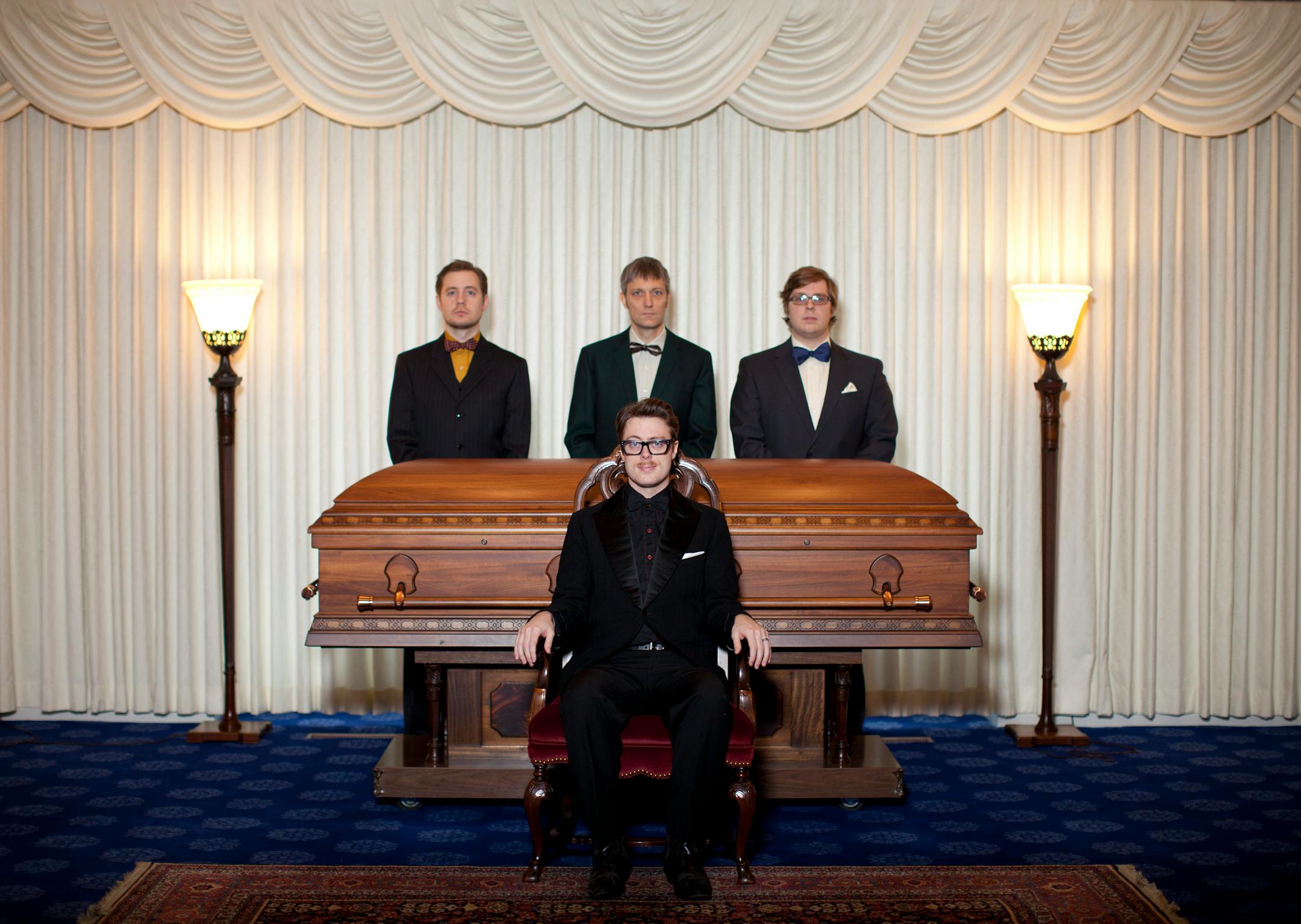JEFF WHEELER â€¢ jeff.wheeler@startribune.com MINNEAPOLIS - 12/23/10 - Jeremy Messersmith and his band gather for a portrait at the Gill Brothers funeral home in South Minneapolis Thursday to commemorate their CD, The Reluctant Graveyard. IN THIS PHOTO: ] Jeremy Messersmith, foreground, with band members Andy Thompson, Brian Tighe, and Dan Lawonn, from left, behind him.