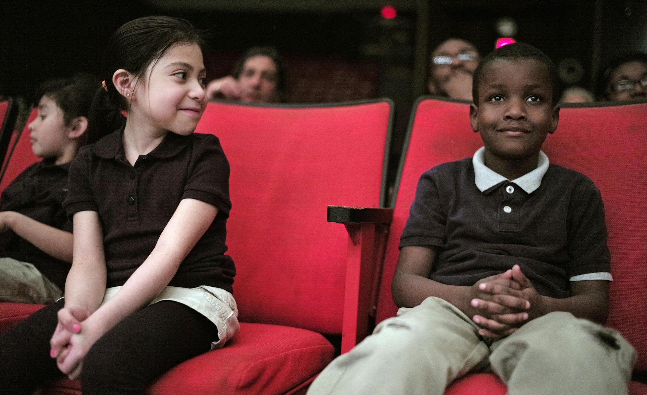 At North H.S., El Sistema students Gezelle Gonzalez-Maldonado and Tremell Caldwell listened to classical program played by the MYS Symphony Orchestra. El Sistema is designed to engage students in classical music as a crime-prevention, social justice program. ]richard.tsong-taatarii/rtsong-taatarii@startribune.com