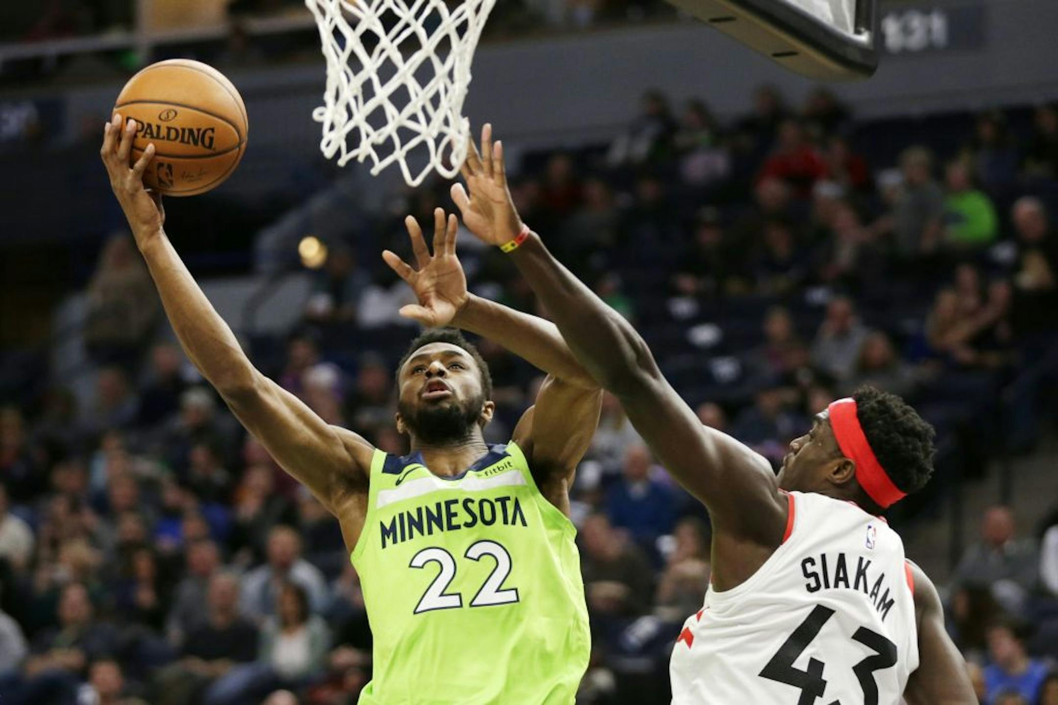 Minnesota Timberwolves forward Andrew Wiggins (22) shoots against Toronto Raptors forward Pascal Siakam (43) in the second quarter of an NBA basketball game Saturday, Jan. 18, 2020, in Minneapolis.