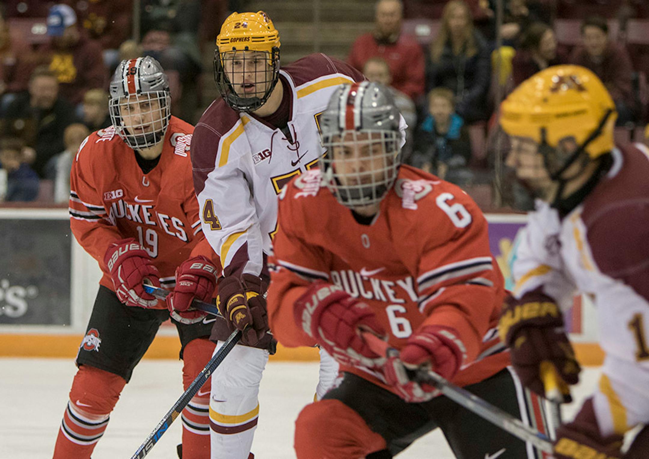 Minnesota Golden Gophers forward Hudson Fasching (24) and Minnesota Golden Gophers forward Taylor Cammarata (13) set up in front of the net while Ohio State Buckeyes defenseman Tommy Parran (6) and Ohio State Buckeyes forward Kevin Miller (19) defend as the Minnesota Golden Gophers hosted the Ohio State Buckeyes to open the Big Ten Conference schedule on December 4, 2015. ] Special to Star Tribune MATT BLEWETT ï matt@mattebphoto.com - December 4, 2015, Minneapolis, MN, Big Ten Hockey, Minnesota