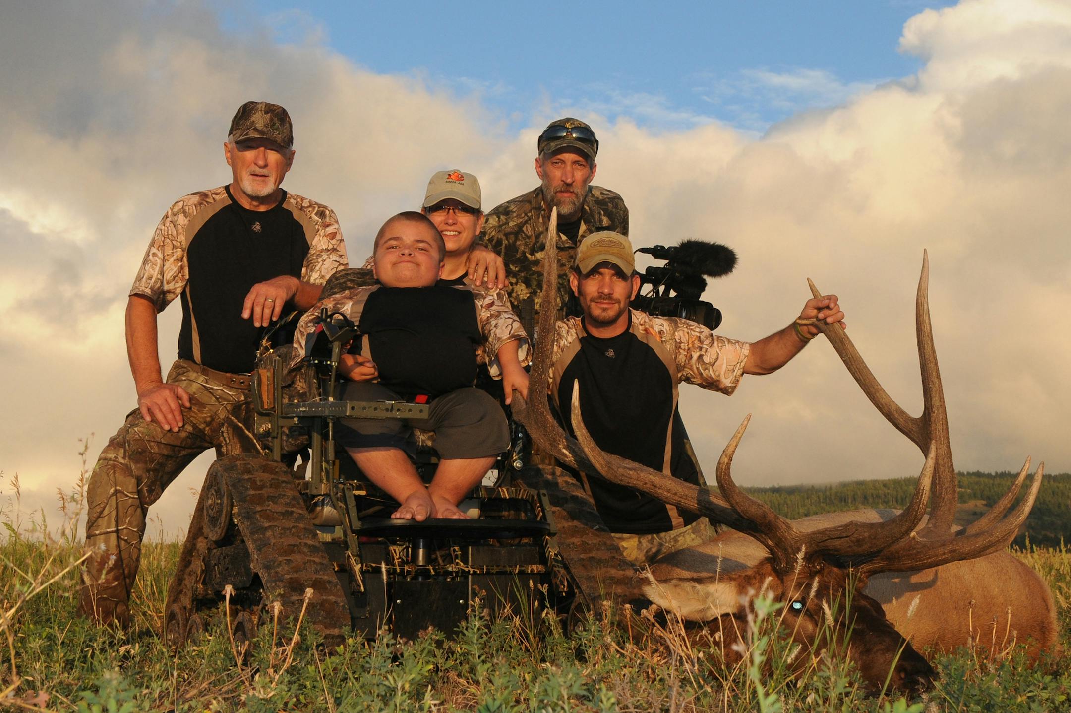 Brad Marcello poses with the elk he bagged in Idaho last fall. With him, left to right, is his step-father, Roger Gebhard, his mother, Lori Gebhard, friend and videographer Ron Hill and Eric Steingraber of Shot for Hope, a non-profit group that paid for Brad's hunt. Photo courtsey Ron Hill
