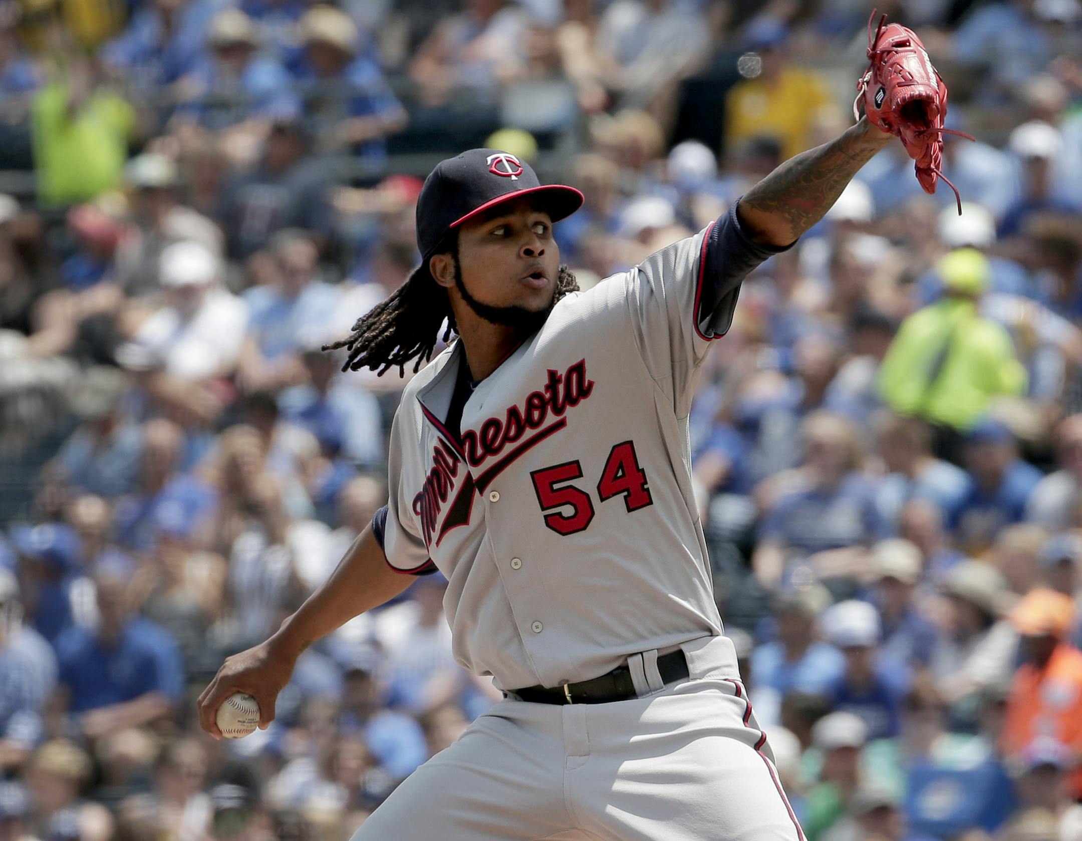 Minnesota Twins starting pitcher Ervin Santana throws during the first inning of a baseball game against the Kansas City Royals, Sunday, July 5, 2015, in Kansas City, Mo. (AP Photo/Charlie Riedel)