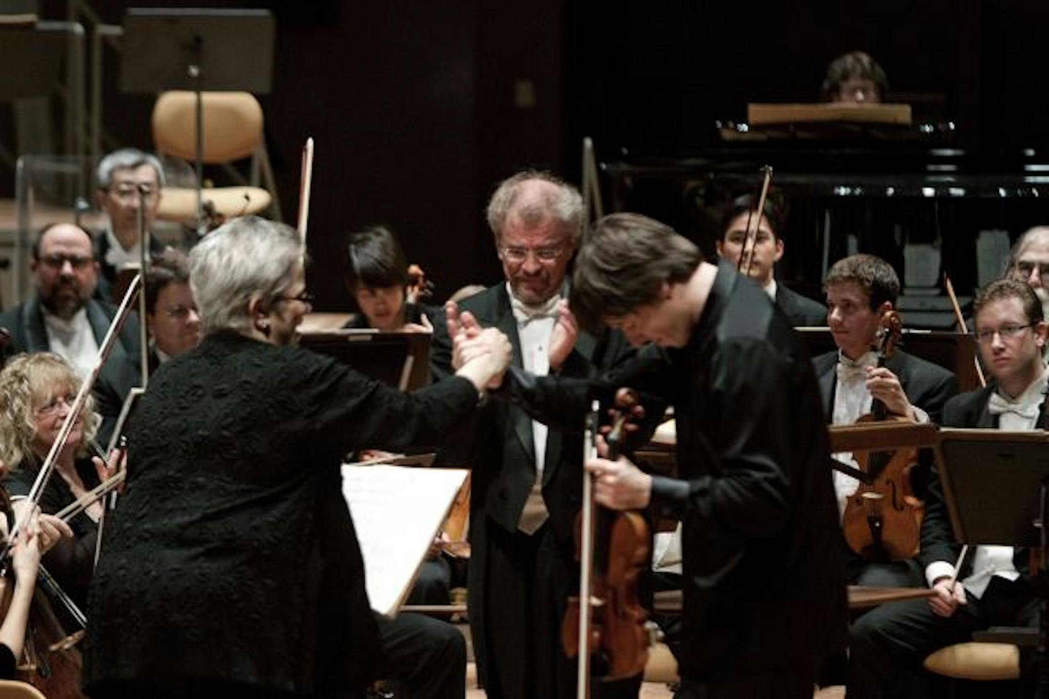 Minnesota Orchestra concertmaster Jorja Fleezanis, music director Osmo Vanska and soloist Joshua Bell, after performing the Barber Violin Concerto in Berlin Wednesday.