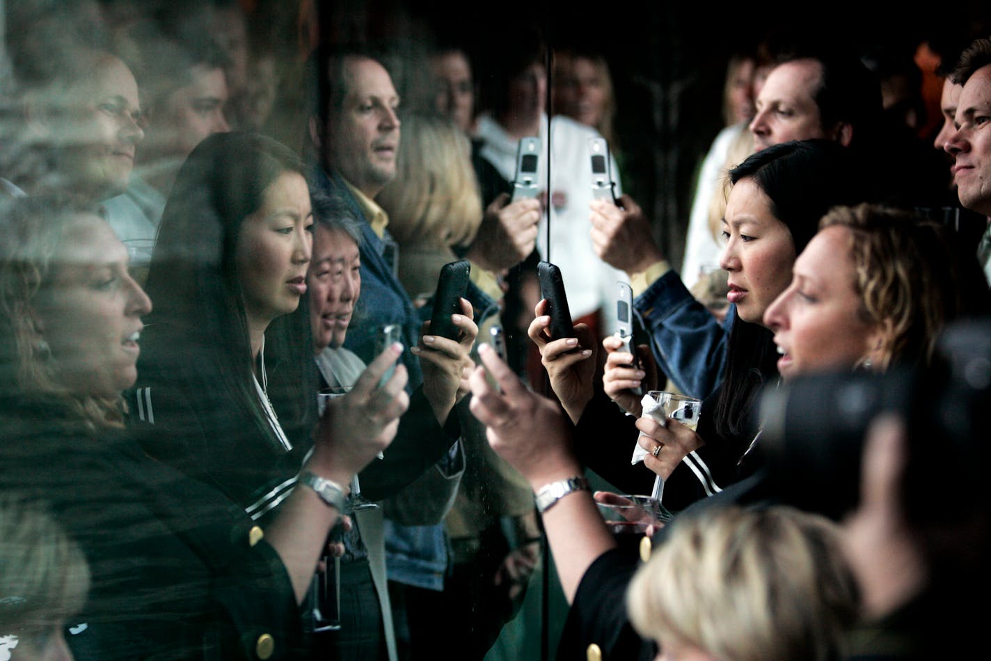 Crowds were wowed by grizzly bears Tuesday and whipped out their cell phones to capture images at the Minnesota Zoo. Feeding zones draw the animals close to people.