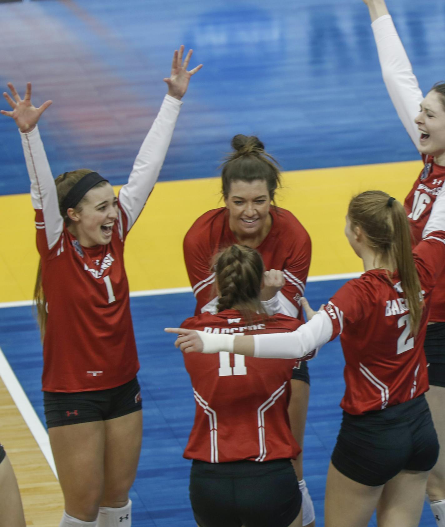 The Wisconsin team celebrates after defeating Baylor in a semifinal of the NCAA Division I women's volleyball championships, Thursday Dec. 19, 2019, in Pittsburgh. (AP Photo/Keith Srakocic)