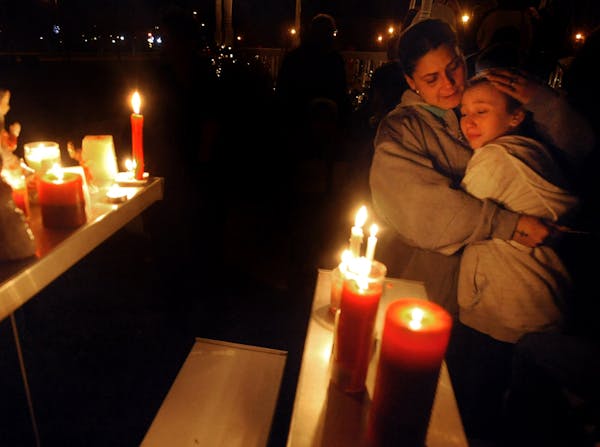 A candlelight vigil in Enfield, Conn., for school shooting victims in Newtown as residents in Enfield, 70 miles away.f