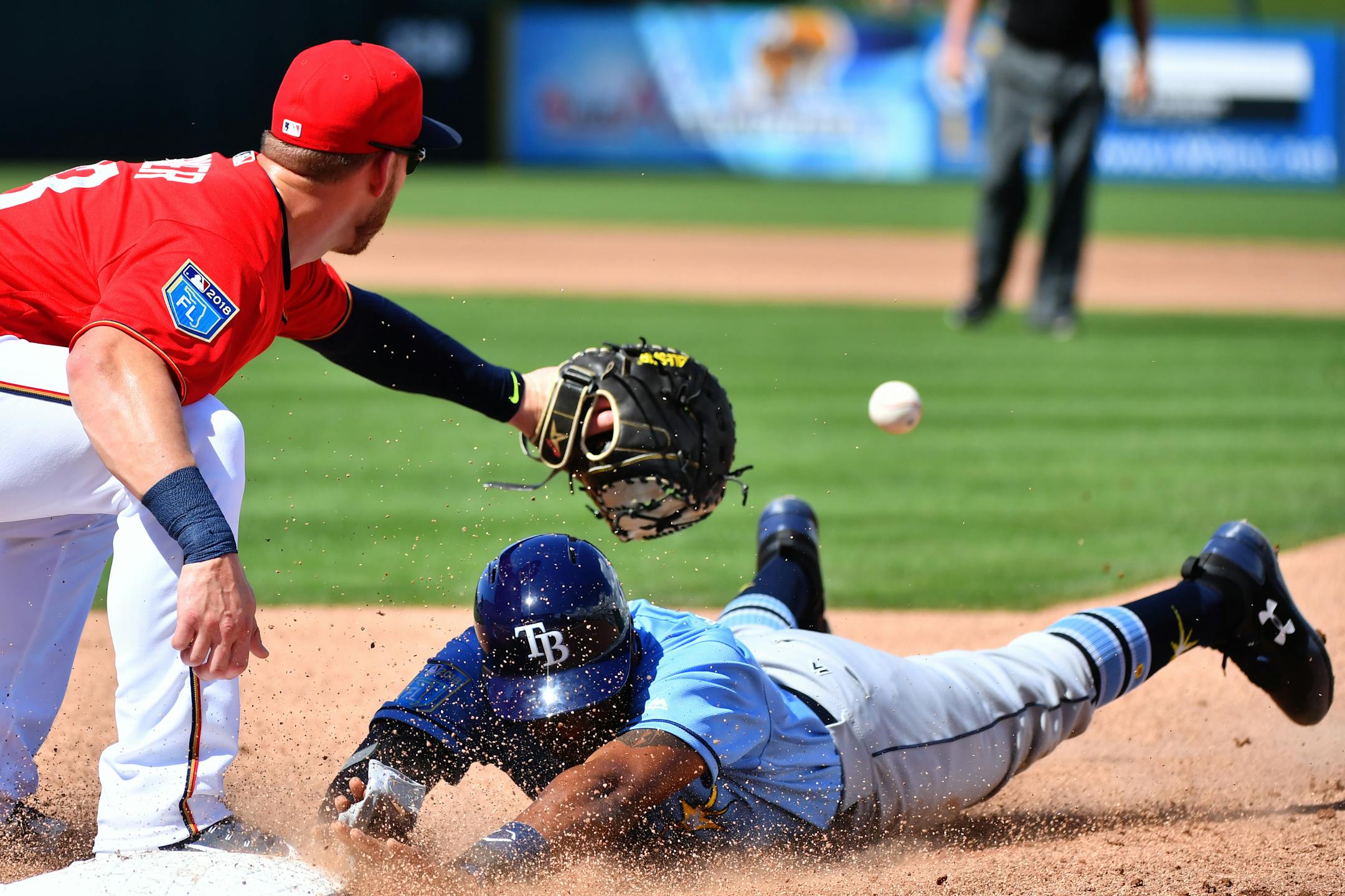 Rays outfielder Justin Williams beat a throw back to first base during a game this spring in Florida.