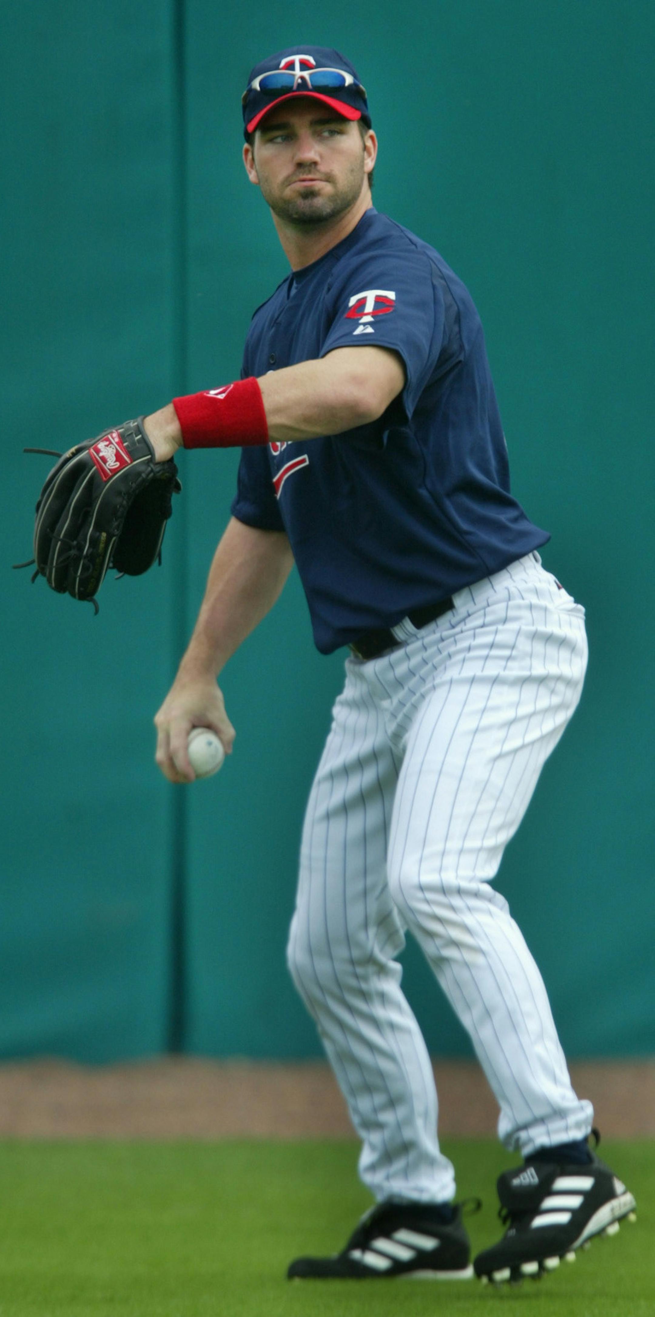 Ft. Myers, FL;3/3/04;left to right:At the Twins spring training facility, B.J. Garbe goes through some fielding drills.