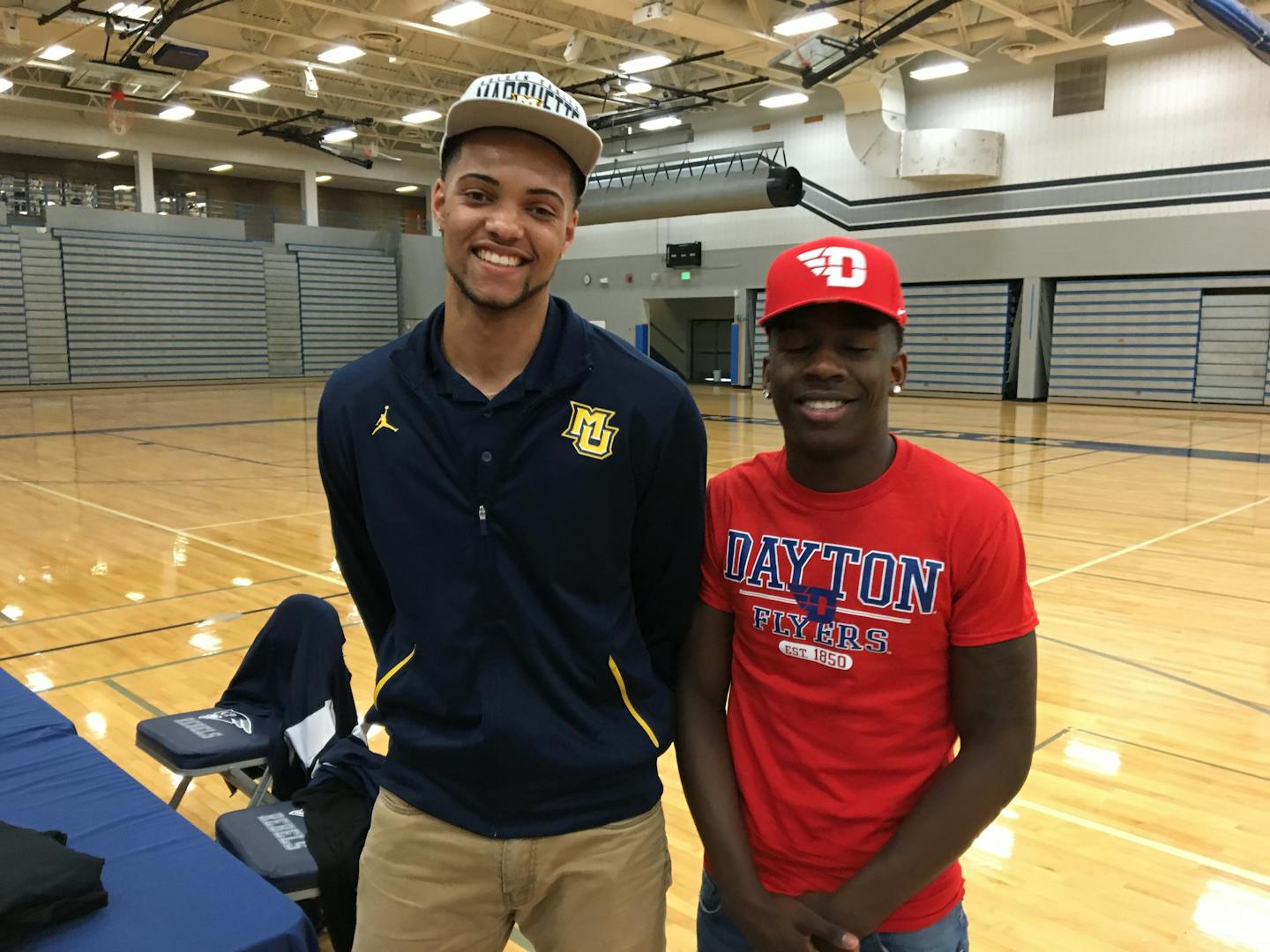 Champlin Park basketball players Theo John, left, and McKinley Wright made their college choices Tuesday. John will go to Marquette; Wright is headed to Dayton.