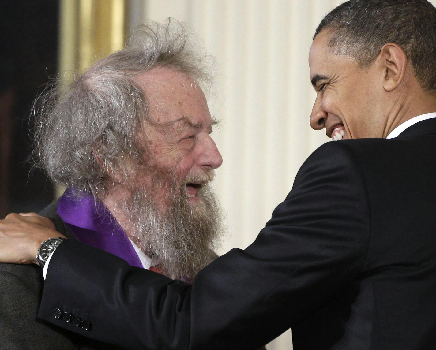 President Barack Obama presents a 2010 National Medal of Arts to poet Donald Hall, Wednesday, March 2, 2011, during in a ceremony in the East Room of the White House in Washington. (AP Photo/Charles Dharapak) ORG XMIT: WHCD109