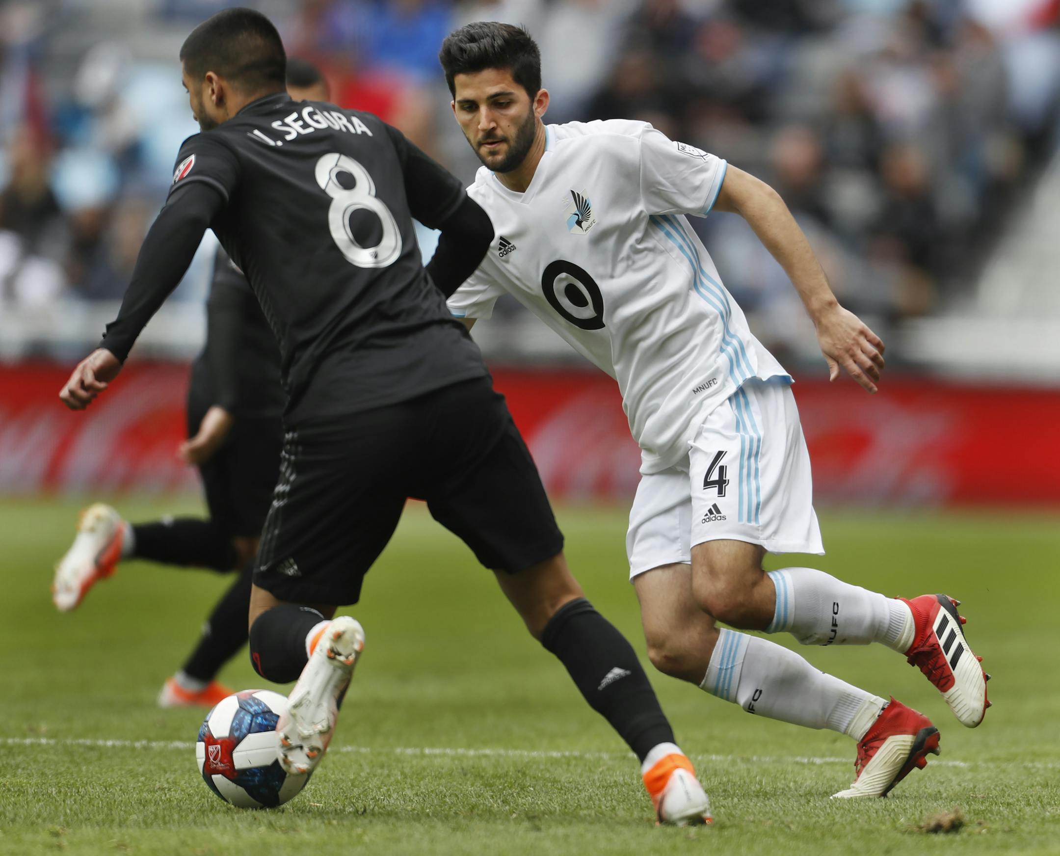Eric Miller(4) of the Loons(4) defends against Ulises Segura(8).] The Loons take on D.C. United at Allianz Field in St. Paul, MN. RICHARD TSONG-TAATARII ¥ richard.tsong-taatarii@startribune.com