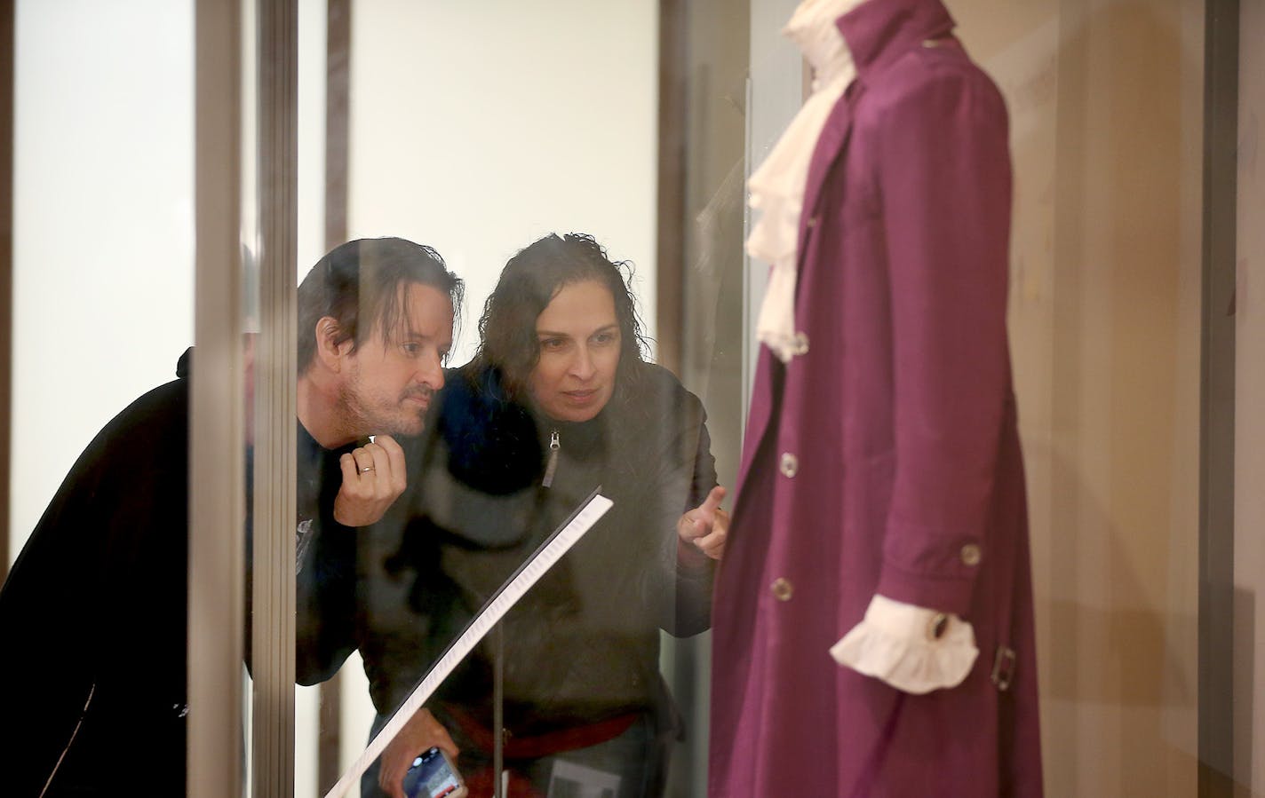 Scott Ewing and his wife Gina Easley, cq, viewed Prince's Purple Rain outfit that is on display at the Minnesota History Center, Friday, April 22, 2016 in St. Paul, MN. The couple went there after leaving First Avenue. ] (ELIZABETH FLORES/STAR TRIBUNE) ELIZABETH FLORES &#x2022; eflores@startribune.com