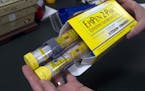 FILE - In this July 8, 2016 file photo, a package of EpiPens, an epinephrine autoinjector for the treatment of allergic reactions is displayed in Sacr
