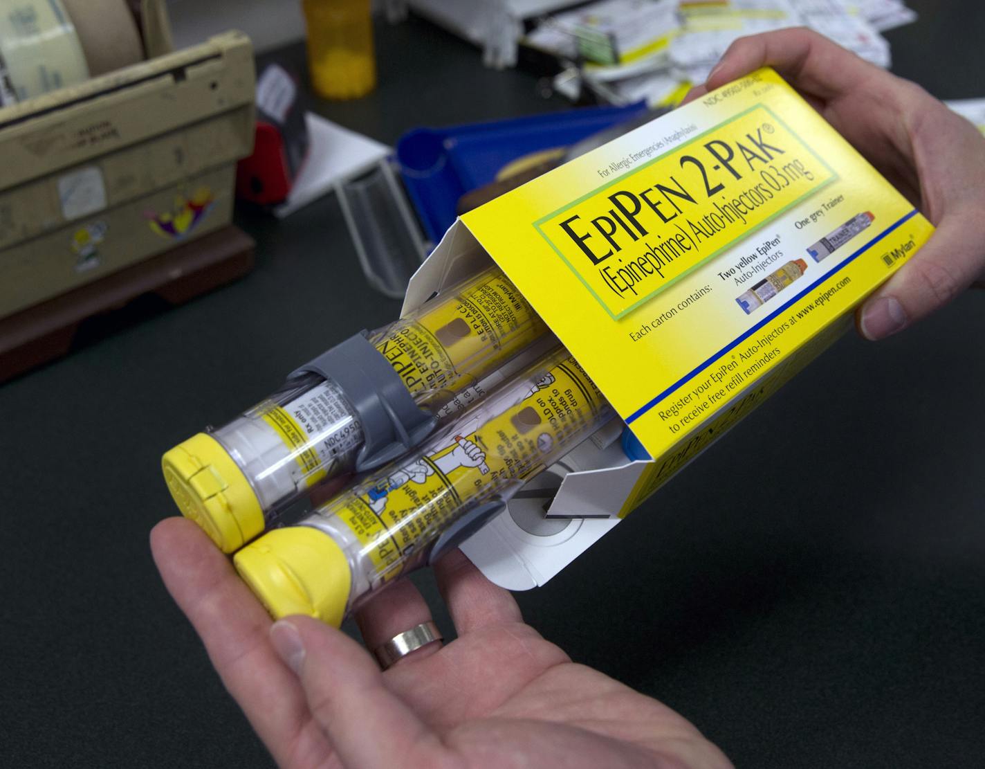 FILE - In this July 8, 2016 file photo, a package of EpiPens, an epinephrine autoinjector for the treatment of allergic reactions is displayed in Sacramento, Calif. Lawmakers are demanding more information on why the price for live-saving EpiPens has skyrocketed. EpiPens are used largely by children to ward off potentially fatal allergic reactions, and its price has surged in recent years.