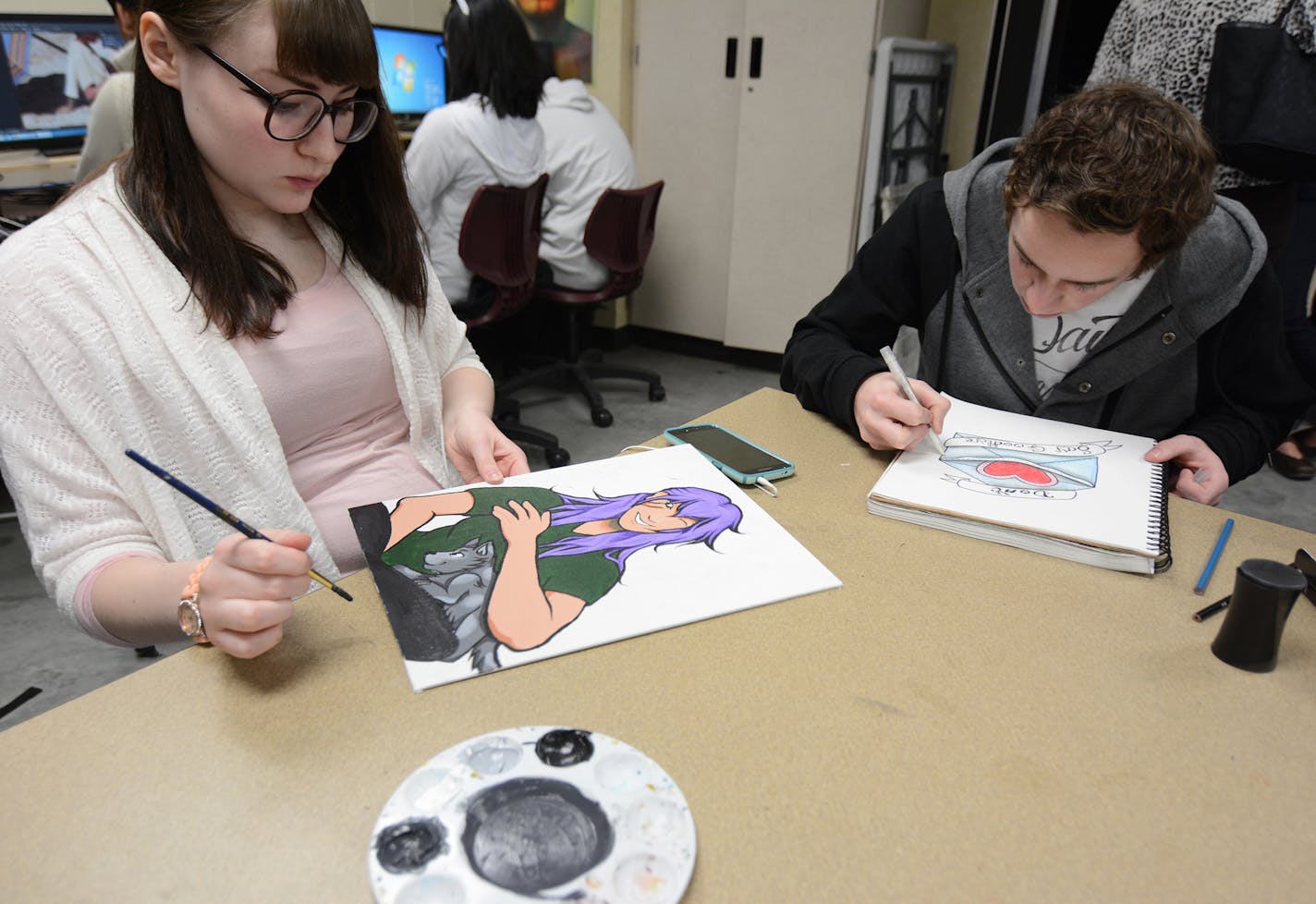 Julia Hance, 16, and Trevor Skarie, 17, worked on their art at Shakopee High School. The two A.P. art students are competing in the upcoming mural contest in Shakopee.Photo by Liz Rolfsmeier, Special to the Star Tribune