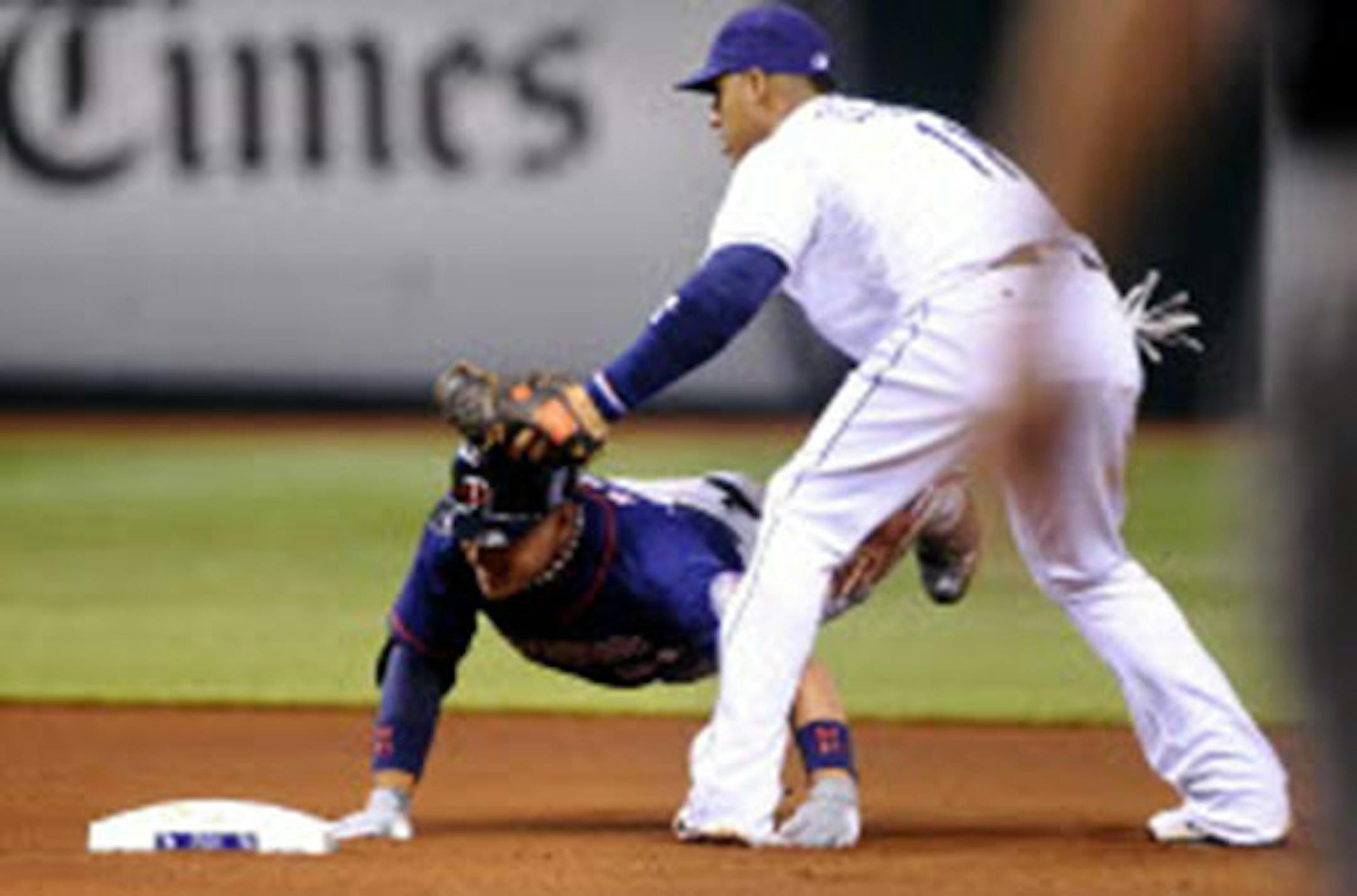 Rays shortstop Yunel Escobar, right, puts the tag on the Twins' Oswaldo Arcia at second base after Arcia attempted to advance on an overthrow during the fourth inning Monday.