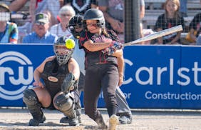 Edgerton/Southwest Minnesota Christian outfielder Kinsie Nelson (28) connects with a pitch against Badger/Greenbush-Middle River in the first inning o