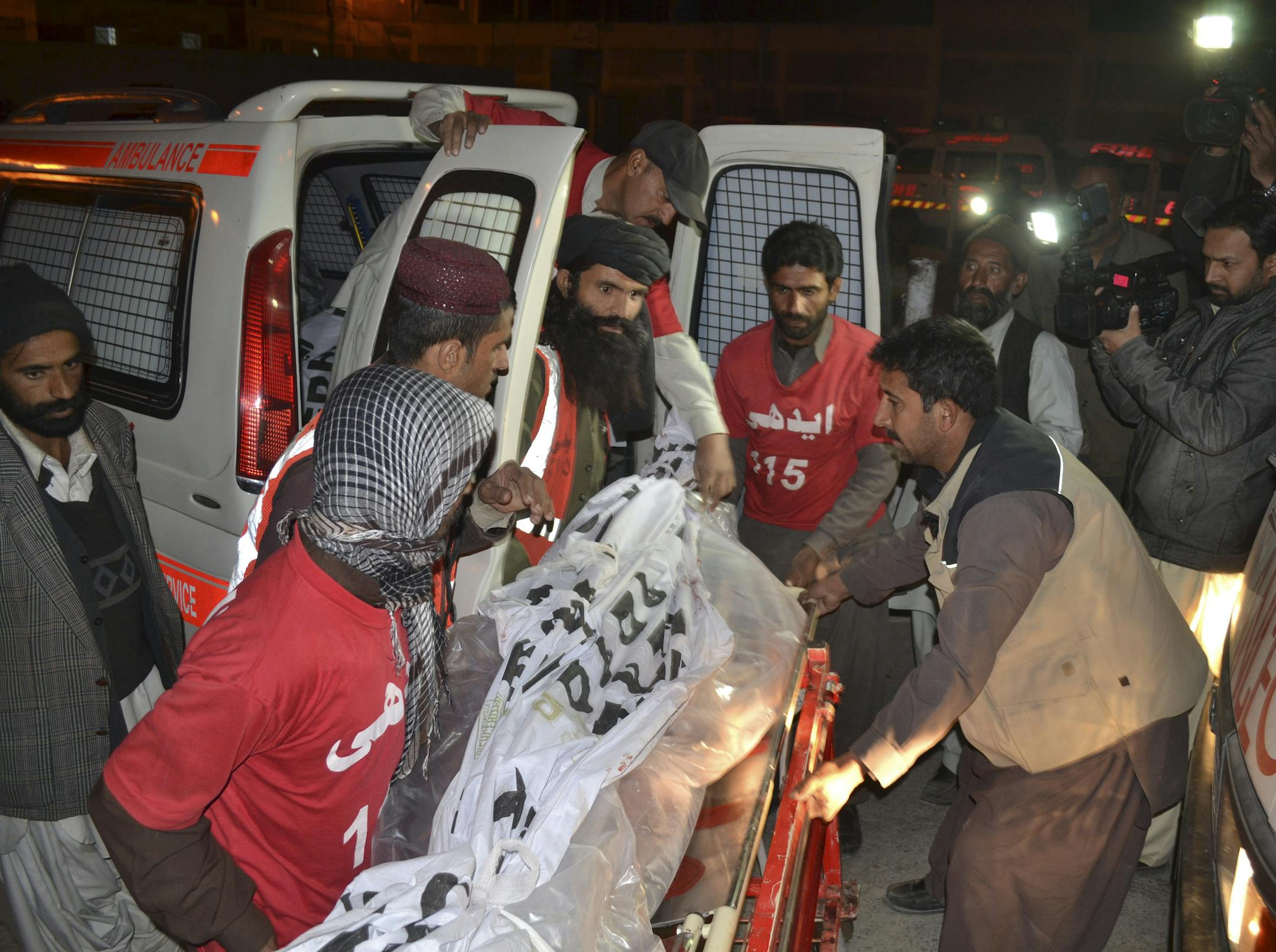 Pakistani volunteers carry the body of a militant killed during a crackdown operation by security forces, in Quetta, Pakistan, Friday, Dec. 19, 2014. Pakistani fighter jets and ground forces bombarded targets in a northwest region bordering Afghanistan, killing 77 Islamic militants, officials said Friday, as the Pakistani army chief late Thursday signed the death warrants of six "hard core terrorists" convicted and sentenced to death by military courts, the army said. (AP Photo/Arshad Butt)